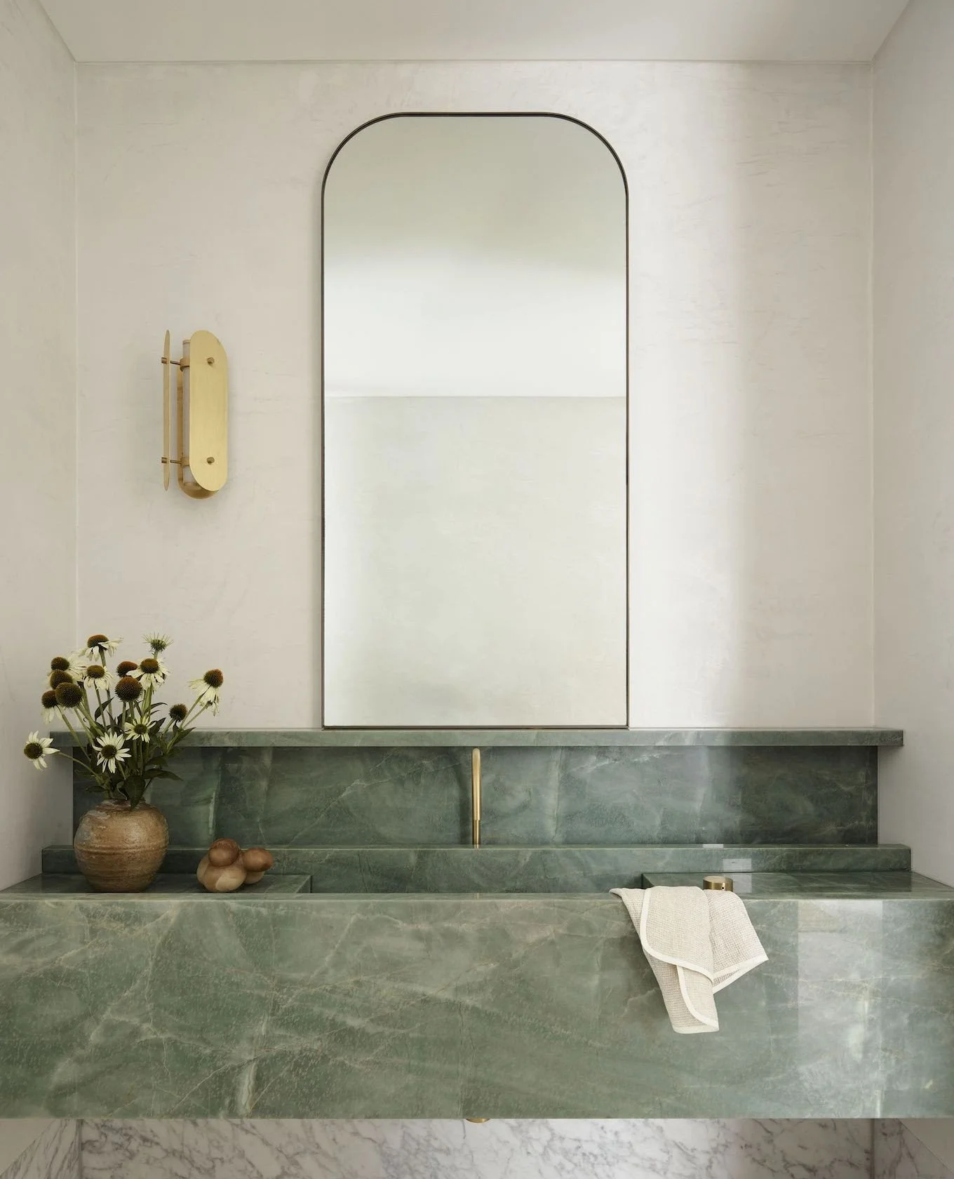 If you look closely, this is a very thoughtfully designed vanity. The marble is simple + understated, the sweet shelf 'catches' the mirror + frames the faucet, and we love the way the soft green + brass play off of one another!⁠
⁠
via @estliving⁠
⁠