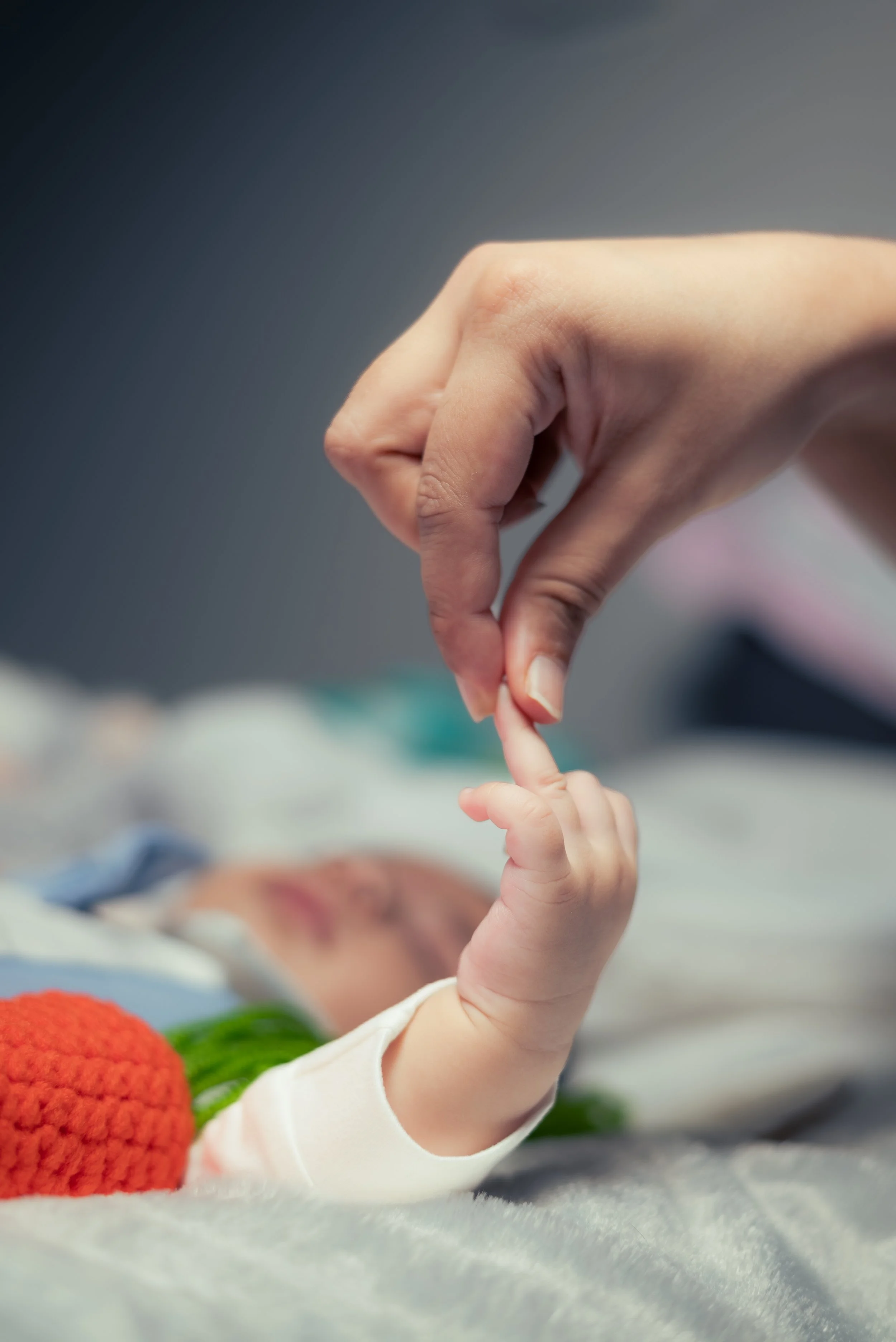 Tiny newborn hand gripping parent's finger - precious first moments | Newborn Photography Kitchener Ontario by Abhijeet Bhullar