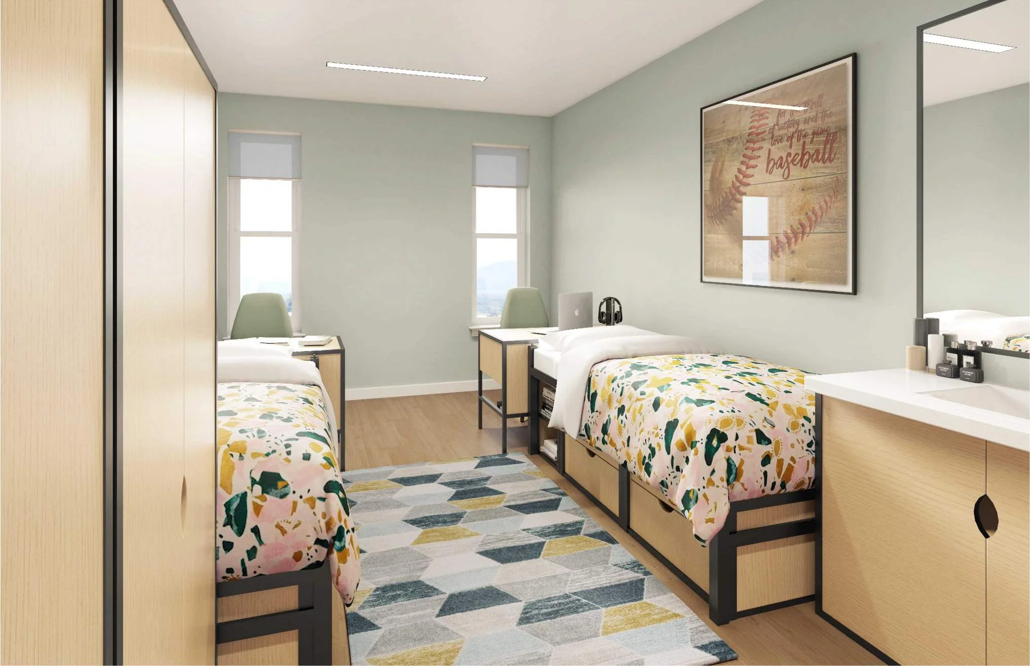 Modern dorm room with two twin beds, colorful bedding, a geometric patterned rug, a desk with a chair, and a large framed baseball-themed artwork on the wall.