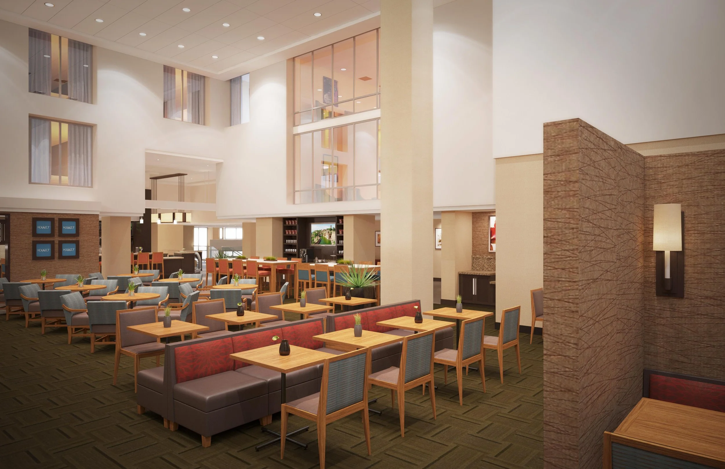 Interior of a modern hotel lobby with multiple seating arrangements, large windows, and a high ceiling.