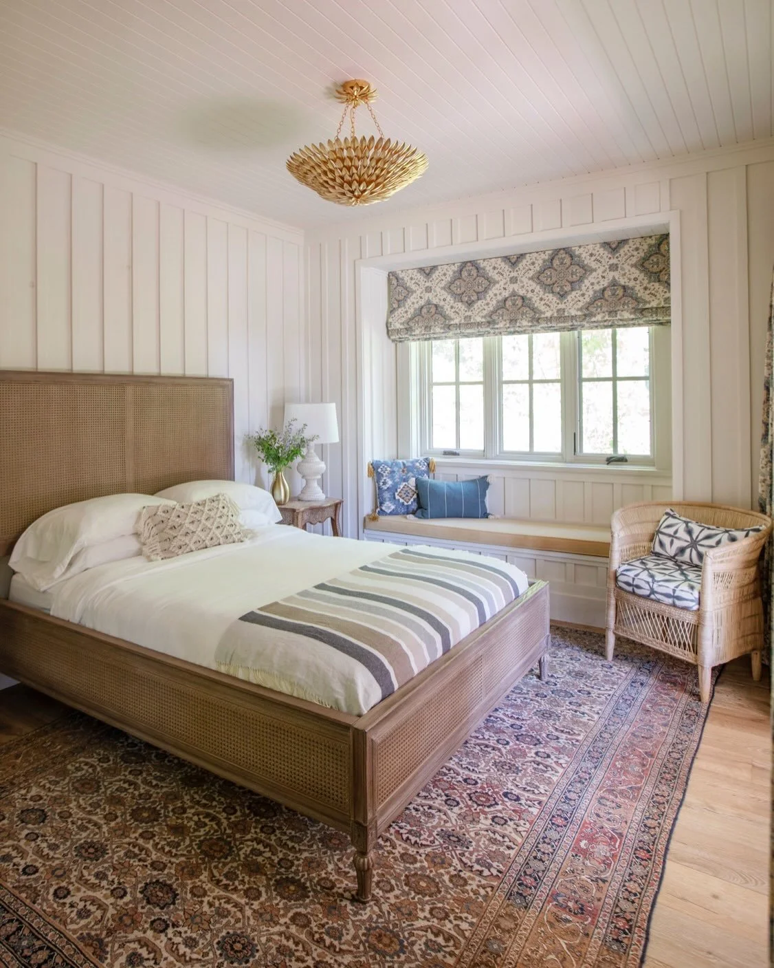 Calm, layered, and a little bit storied. 

This bedroom started with the rug, an antique Persian from LA, everything else followed its lead. 
Crisp shiplap and paneling keep things soft but bring in a soft texture, so the textiles can do the talking.