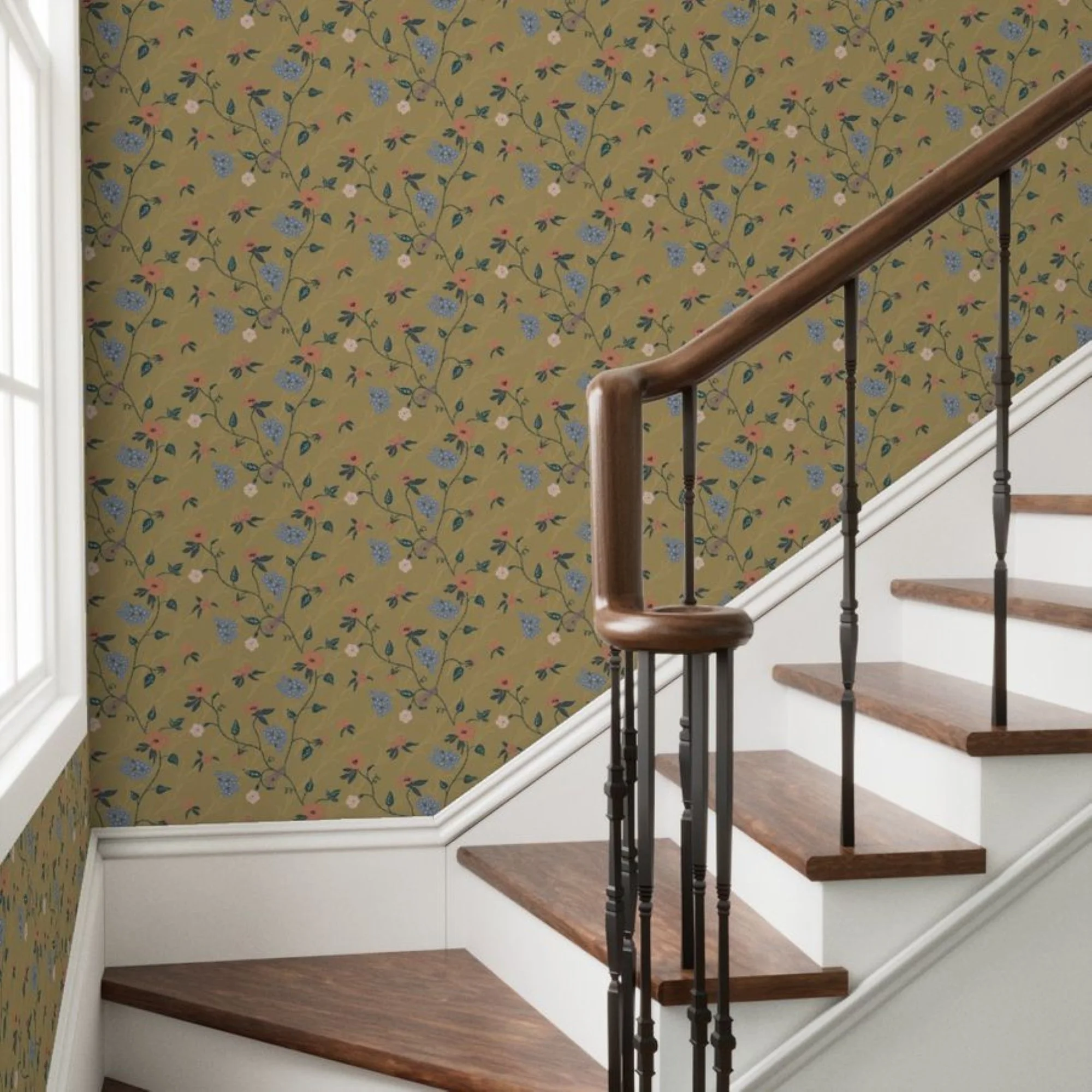 A staircase with wooden steps and black metal railing against a dark gold floral wallpapered wall.
