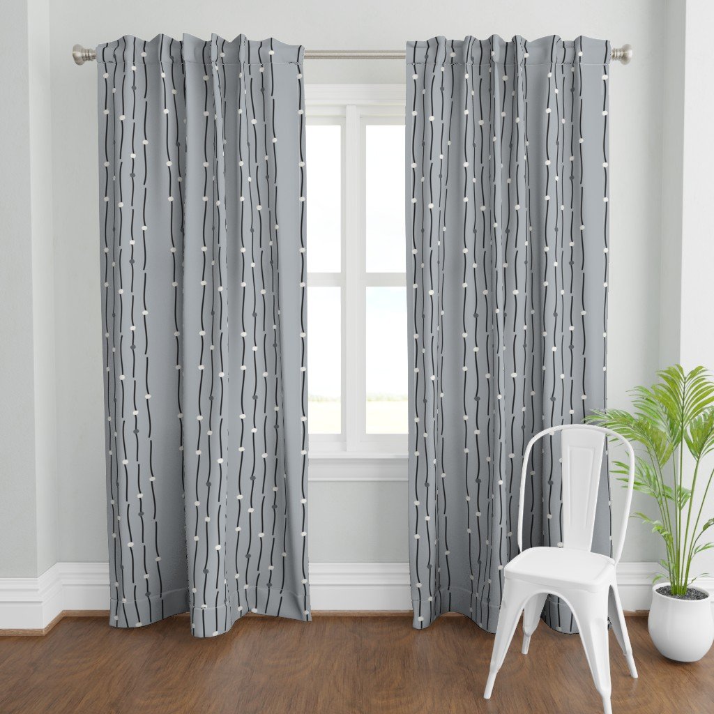 Curtains on a window, featuring dark, charcoal lines with cream stone accents on a slate background.