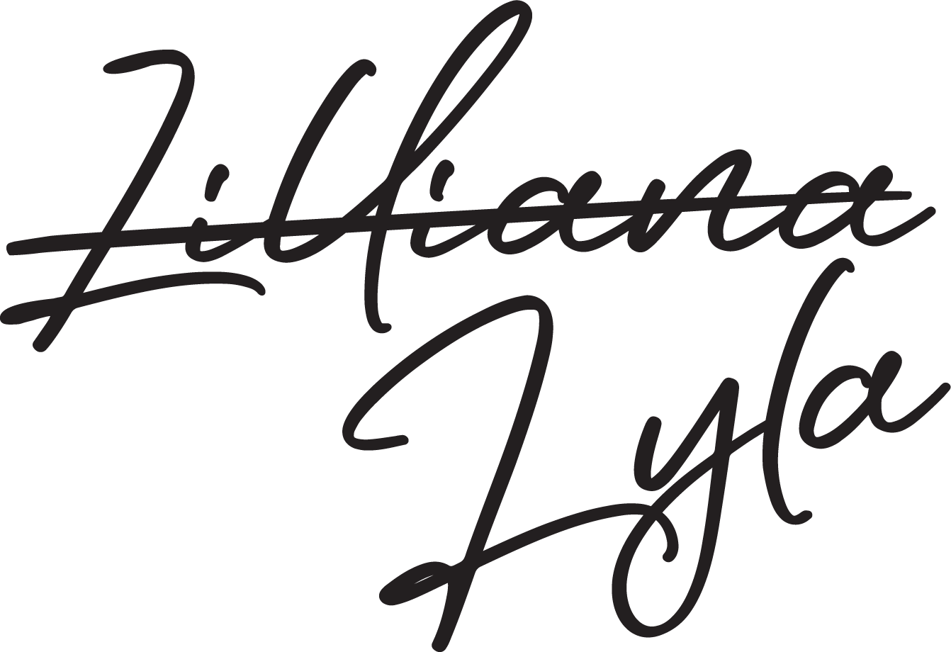 Text reading "Lilliana" and scratched through with the word "Lyla" in a cursive font underneath. It is a nod to the secret identity of Lyla B. in 'The Good Heart Series' by L.M. Thomas' book one: "We Have To Tell Her."