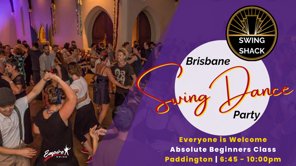 Couples swing dancing at night party