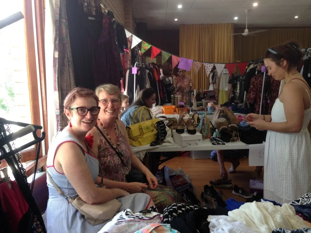 Women selling items at Excess Baggage Secondhand Market