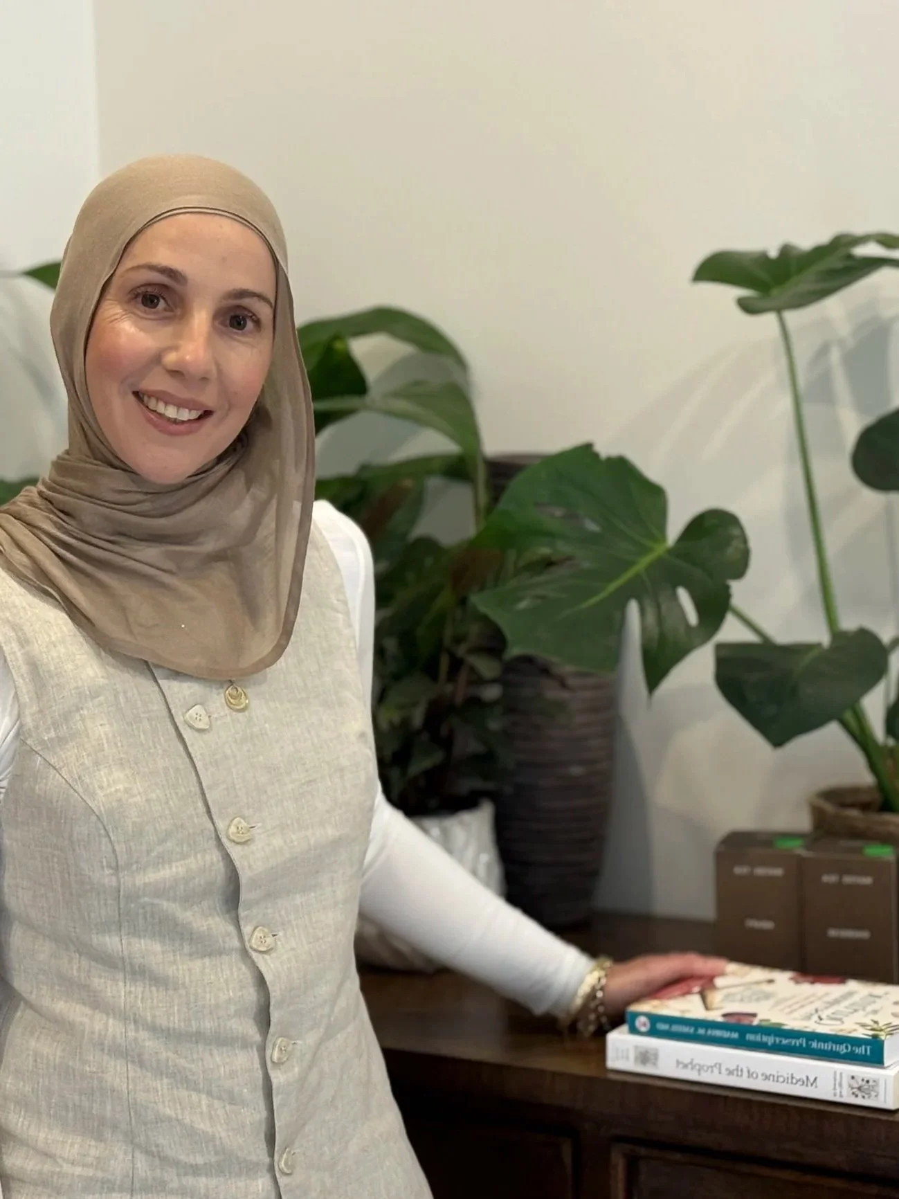 Holistic nutritionist Prue Matar in Earlwood standing in clinic with wellness books and plants, representing Matar Health