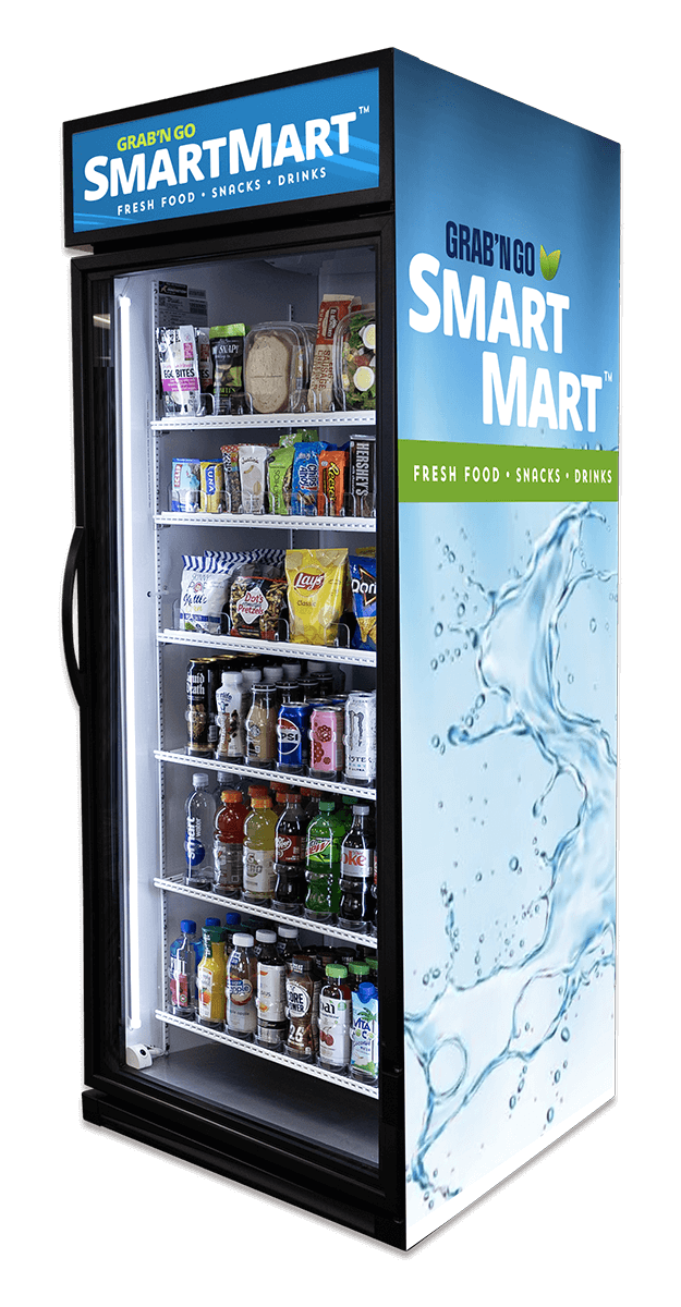 A vending refrigerator stocked with snacks, drinks, and bottled beverages inside. The exterior features the branding 'Grab'n Go Smart Mart' with a blue and green design and water splash graphics.