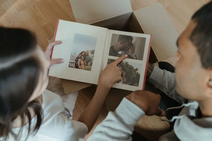 family looking at custom photo book