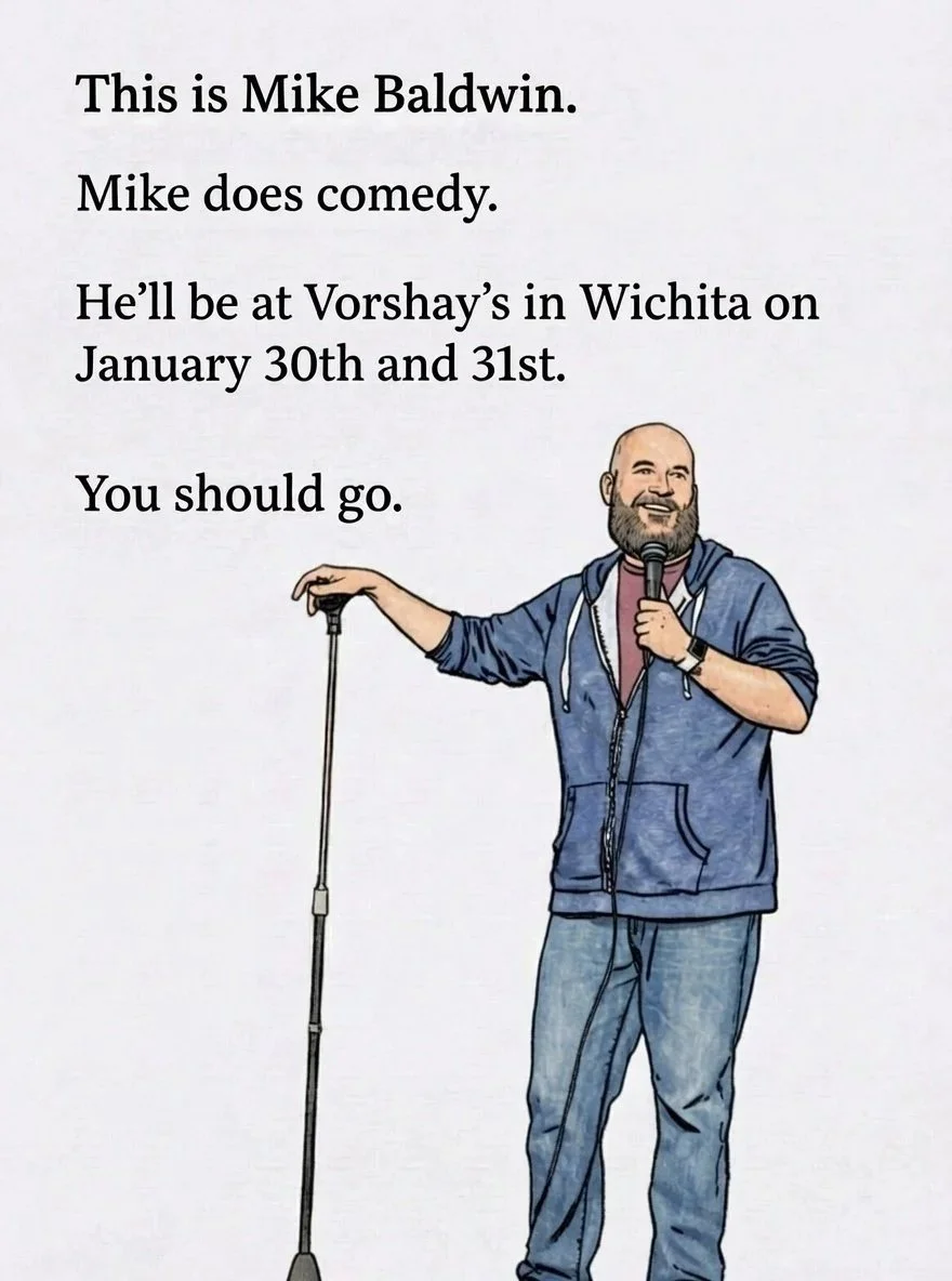 Cartoon of a man with a beard, wearing a blue hoodie and jeans, holding a microphone with one hand and a cane with the other, smiling. Text on the left introduces Mike Baldwin as a comedian performing in Wichita on January 30th and 31st, encouraging 