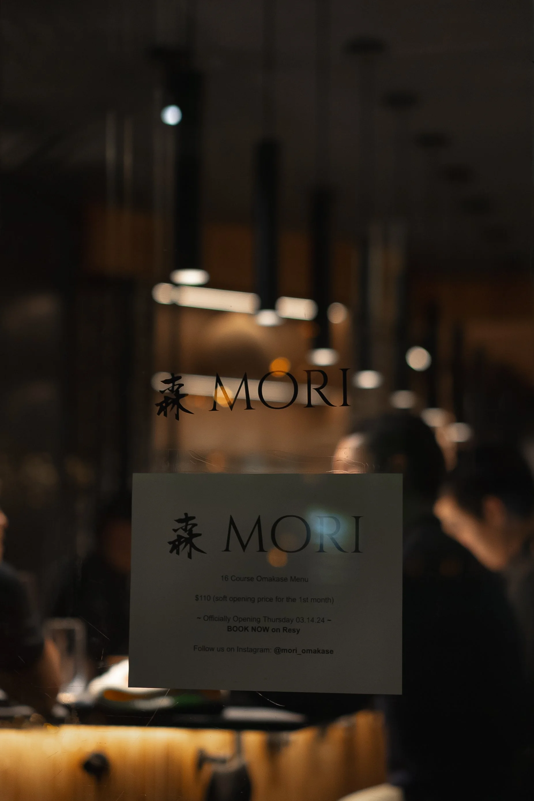 Storefront entrance and vestibule design for Mori Restaurant. Glass facade integration and branding for a Manhattan commercial space. Project management and permitting by XZ Design Build.
