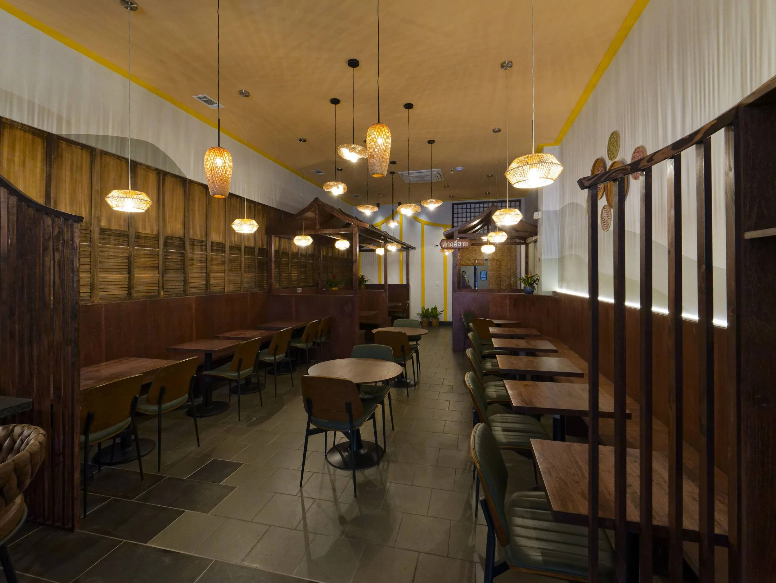 Main dining room floor plan optimizing workflow and customer comfort. Modern Asian restaurant design utilizing natural materials and warm lighting. Construction by licensed architects XZ Design Build.