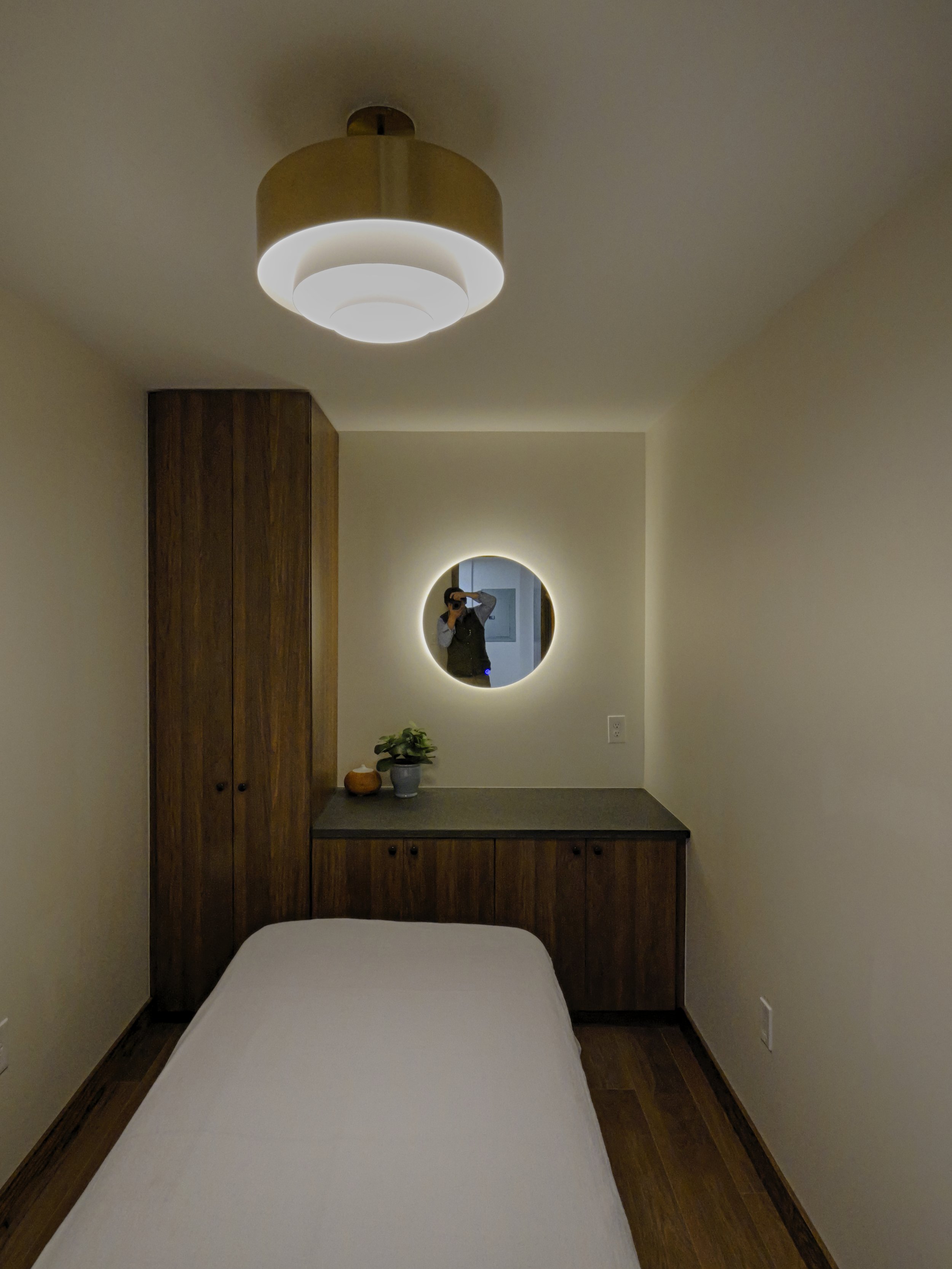 Private treatment room design for a medical spa. Functional, code-compliant healthcare construction featuring specialized lighting and cabinetry. Built by XZ Design Build.