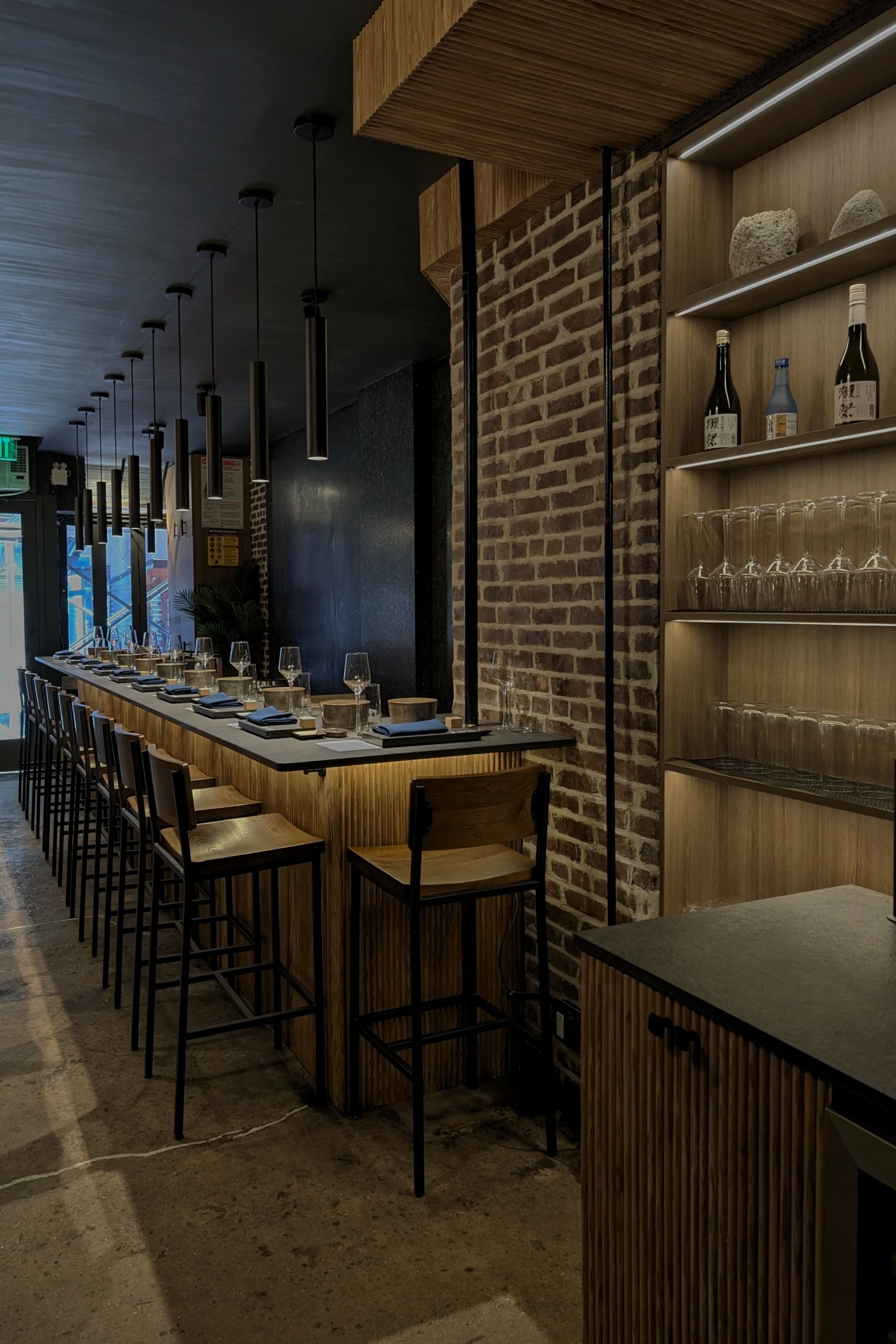 Custom commercial bar seating layout designed for comfort and flow. High-end restaurant renovation in Manhattan featuring durable materials and ergonomic design. Built by XZ Design Build NYC.