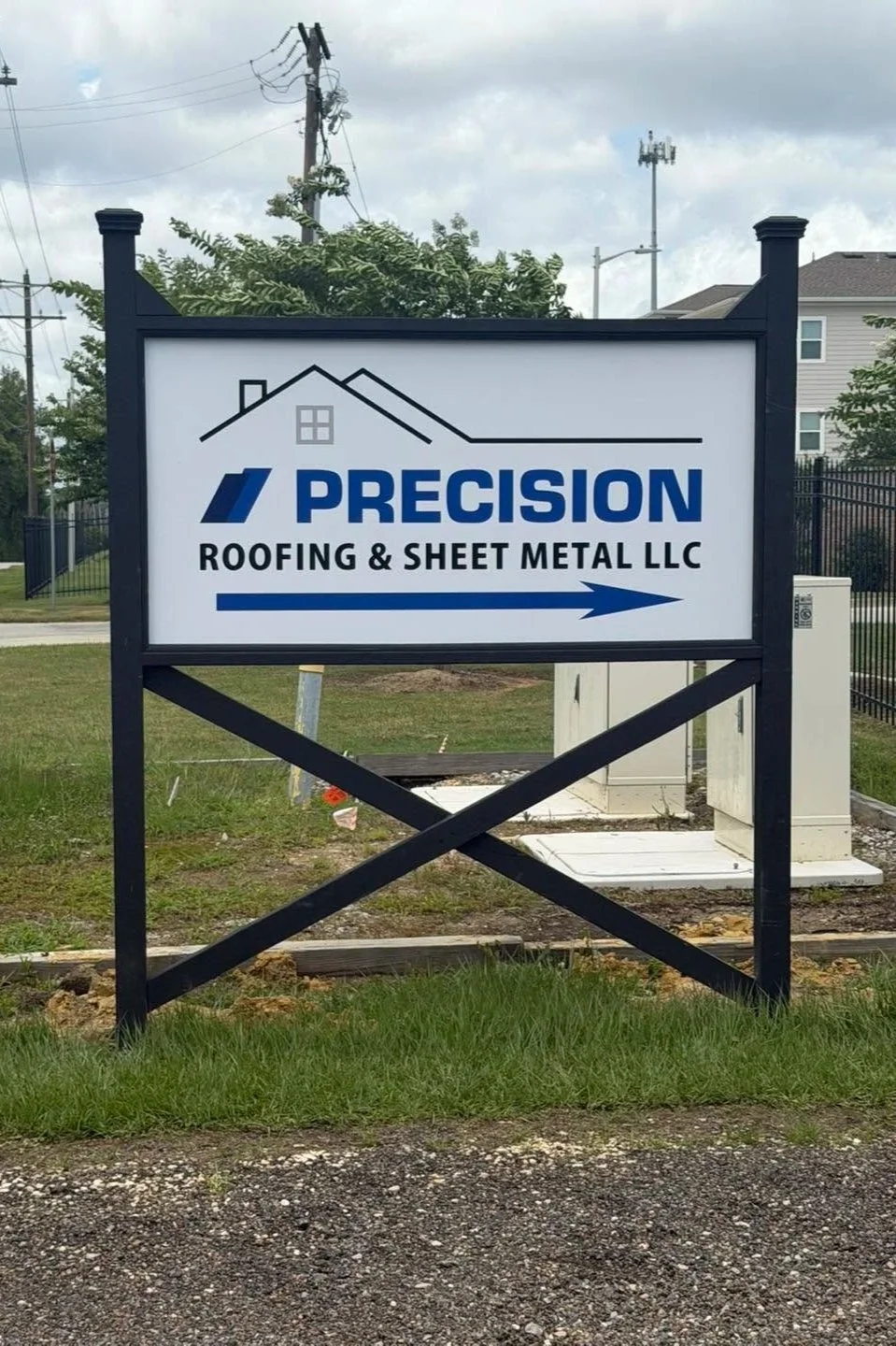 Precision Roofing & Sheet Metal LLC entrance sign directing visitors to the company office in South Mississippi.