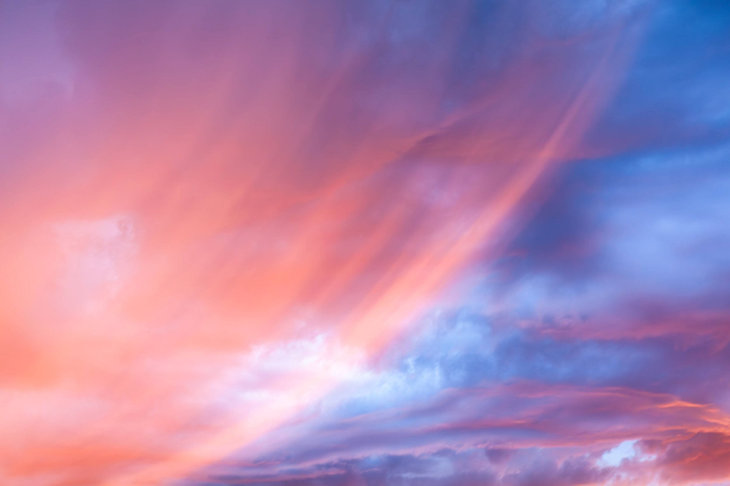 A vibrant sky during sunset with pink, purple, and blue clouds.  Located near City Beach, Perth. 