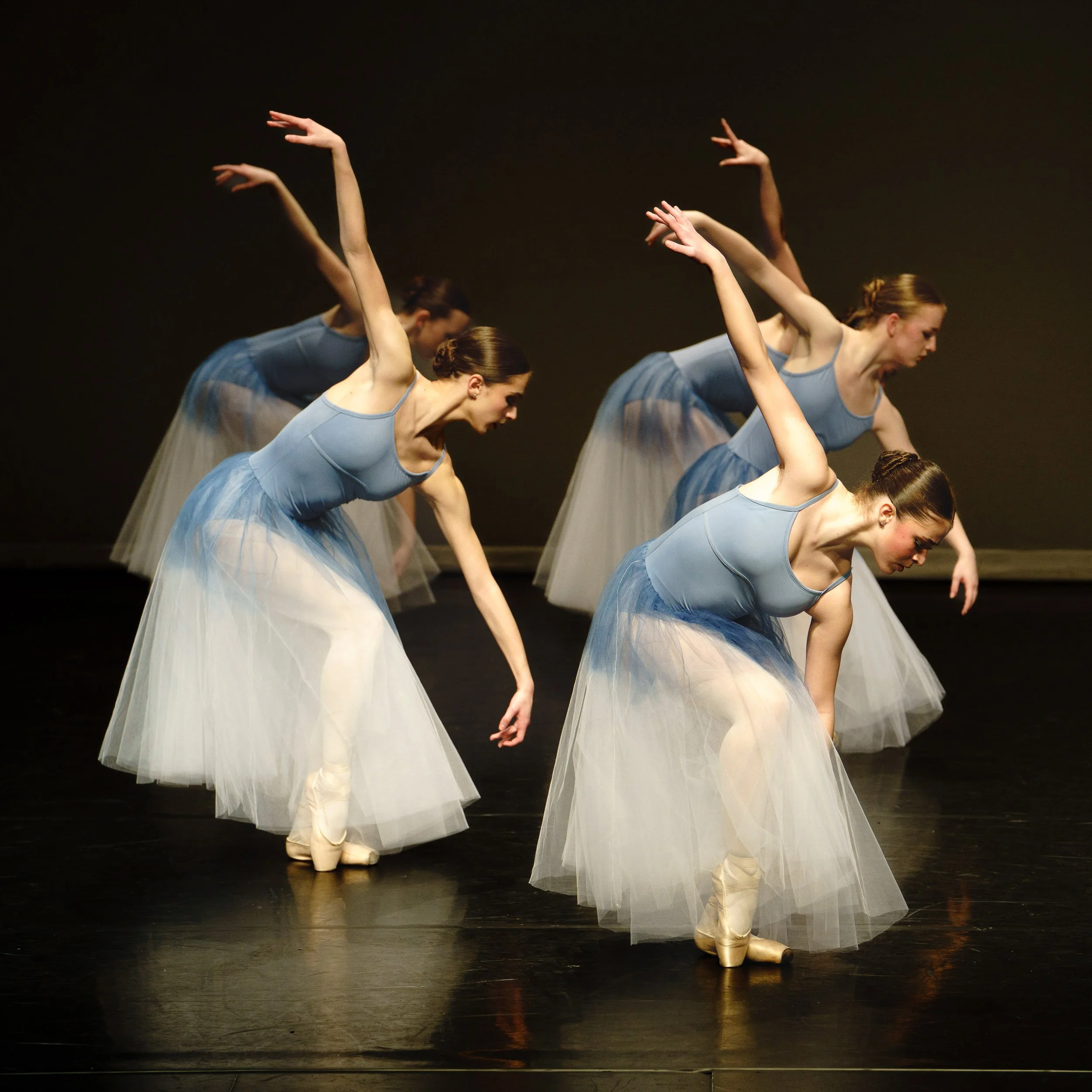 A group of three dancers from Tri-City Dance Center in perfect synchronization.