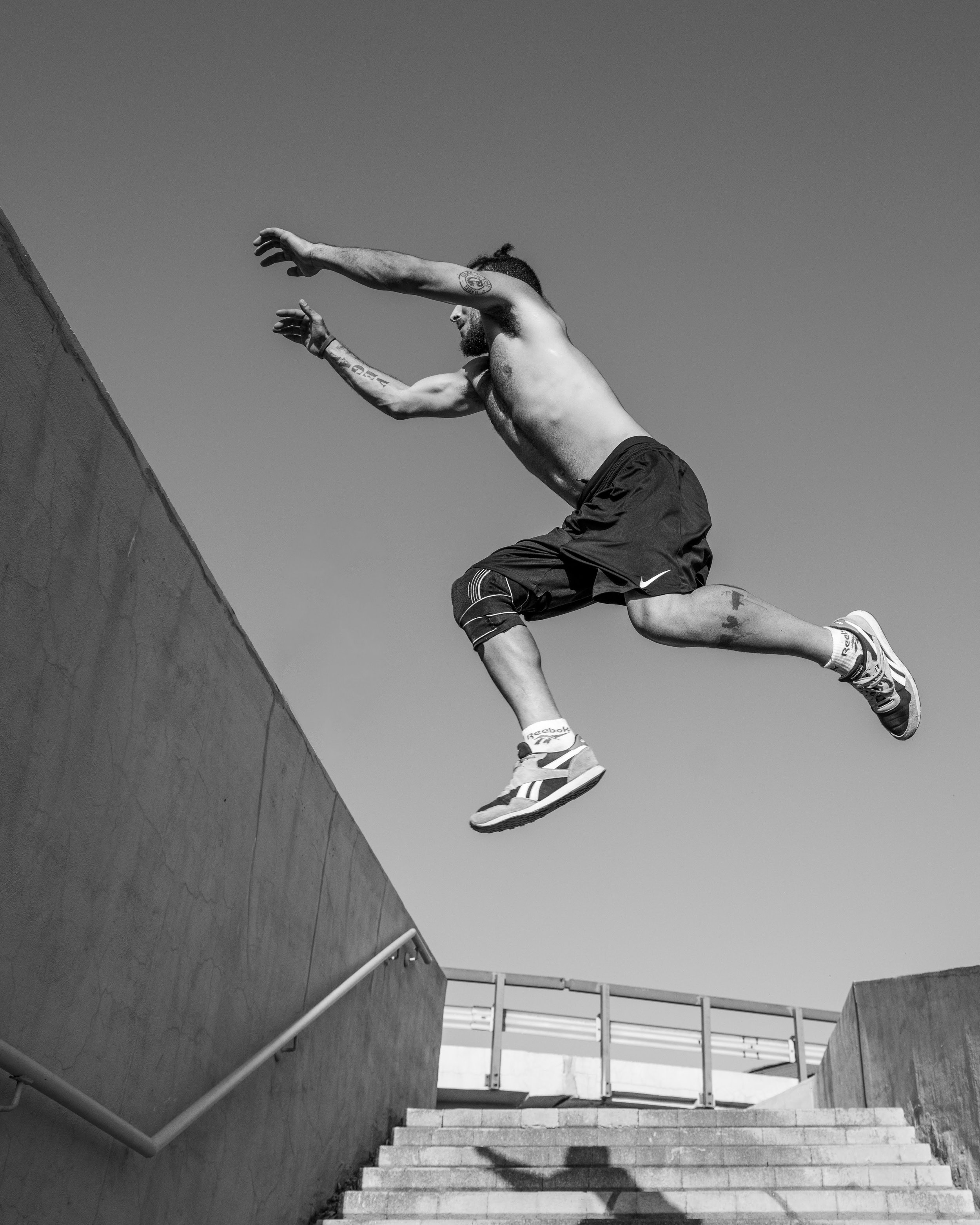 black and white parkour photos. Jumping action.