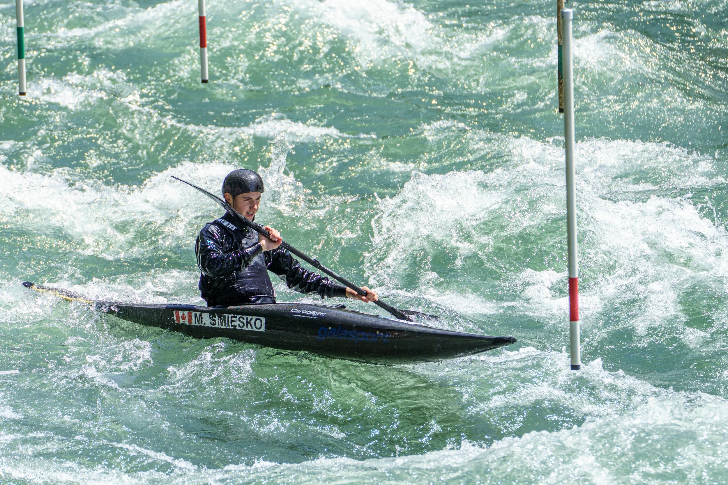 "Canada's national representative training for the Junior World Championships in Kayak Slalom. High-performance sports photography by Peak Action.