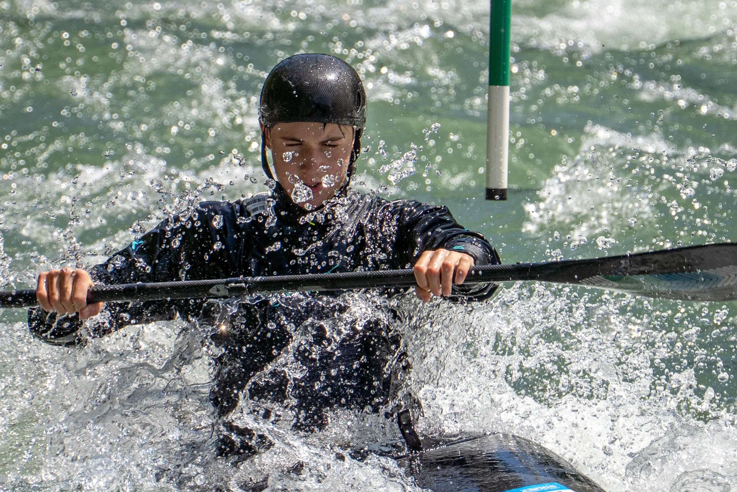 "Canada's national representative training for the Junior World Championships in Kayak Slalom. High-performance sports photography by Peak Action.