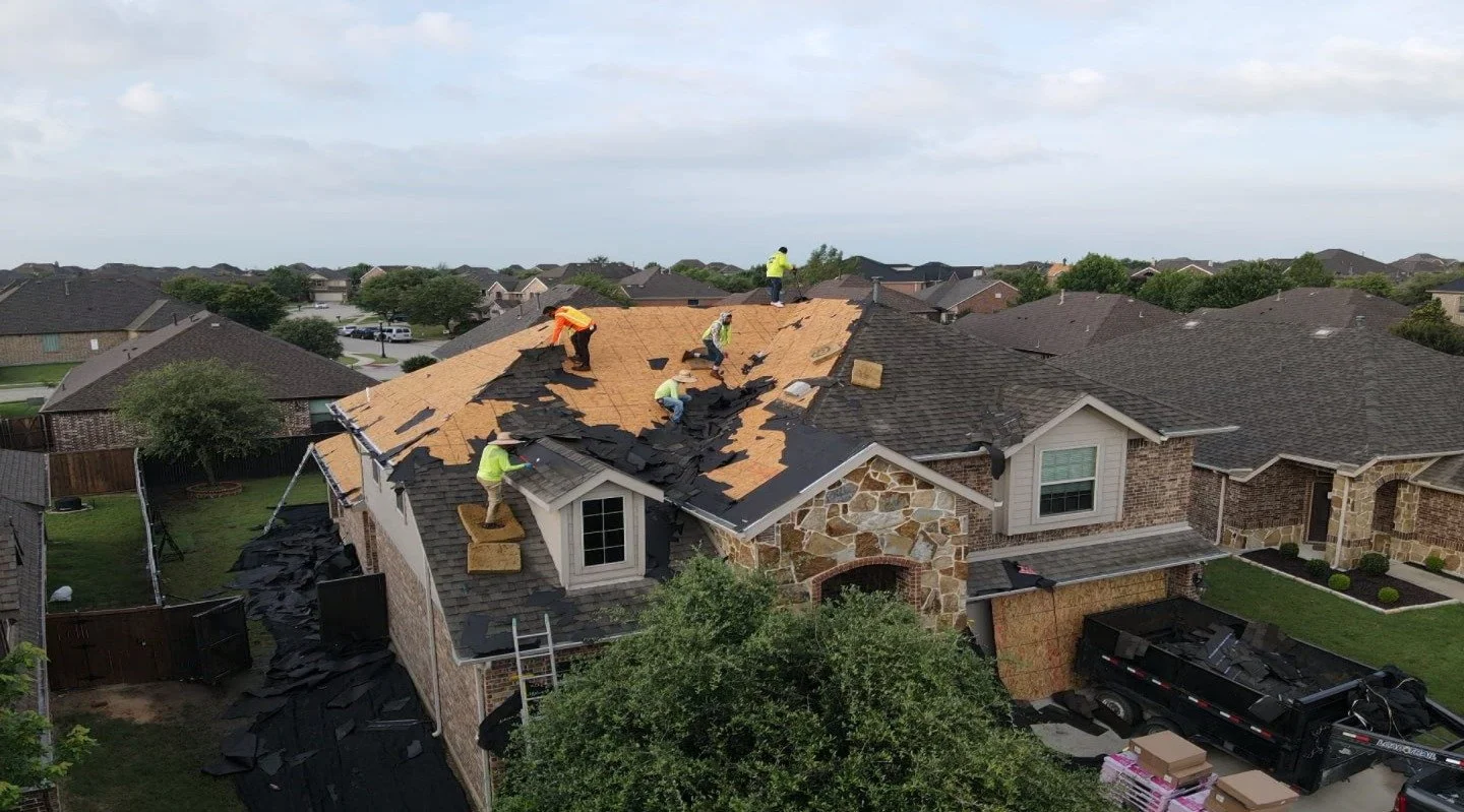 Triumph Roofing crew completing a roof replacement in North Dallas, TX