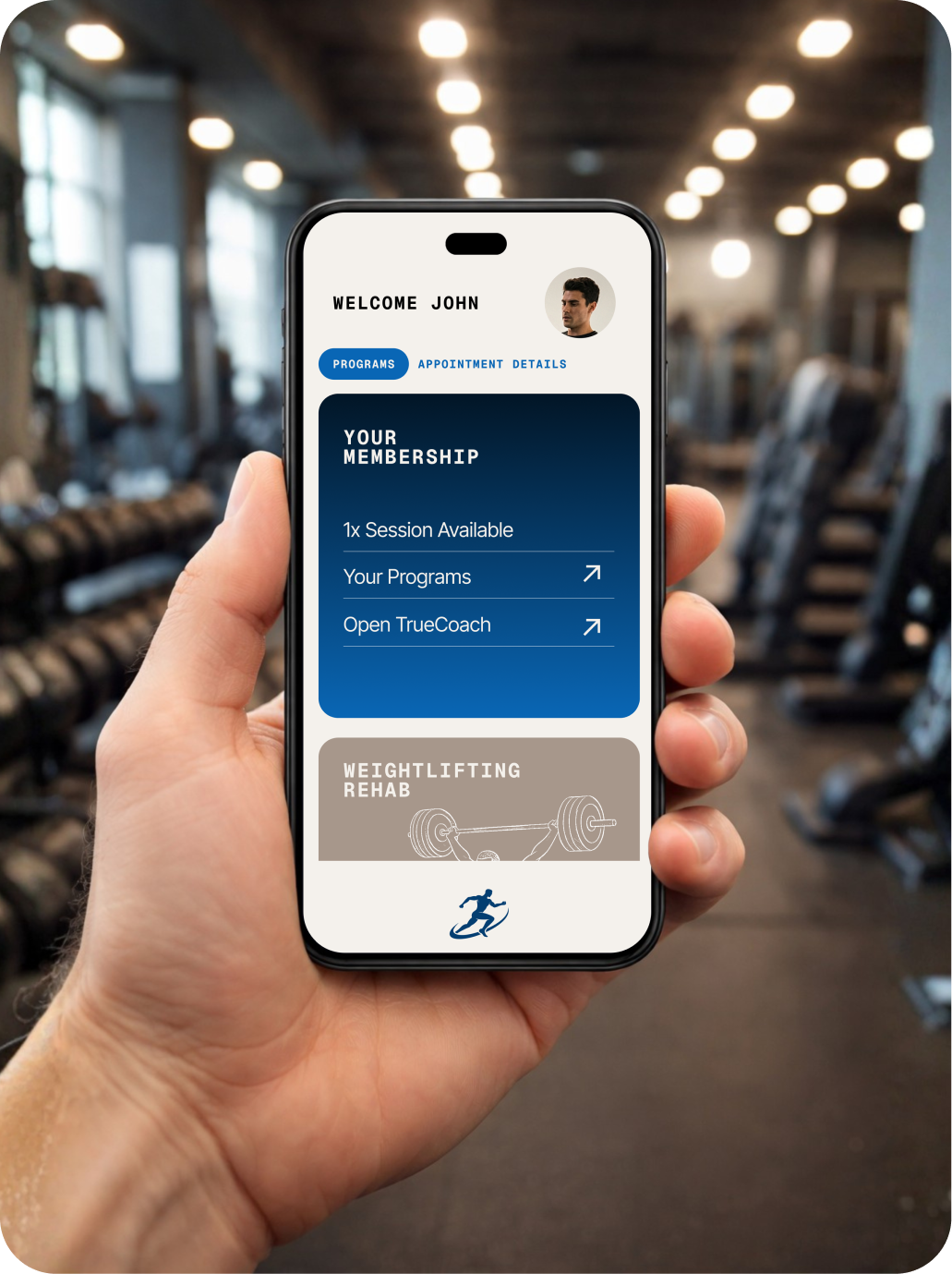 Hand holding a smartphone displaying a fitness app.