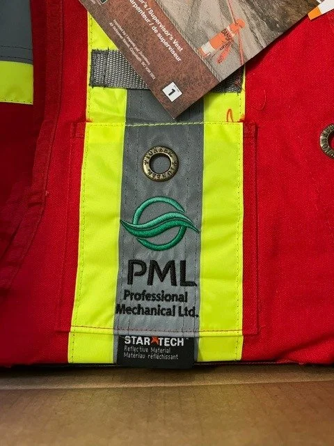 A red safety vest with reflective yellow and gray stripes, featuring logos for PML Mechanical Ltd. and Star Tech, and a metal grommet.