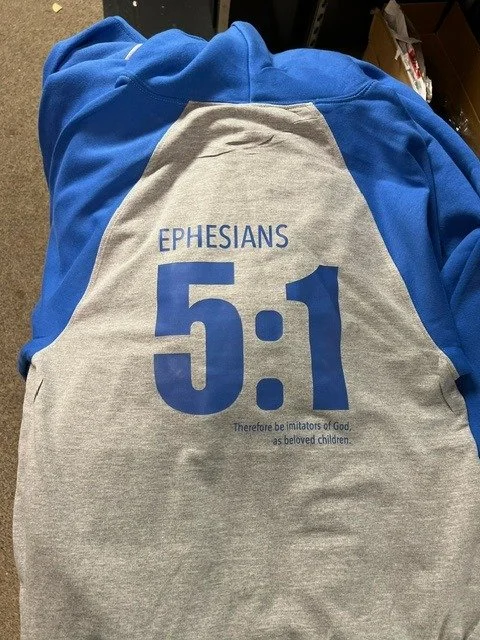 Gray and blue shirt with the text 'EPHESIANS 5:1 Therefore be imitators of God, as beloved children.'