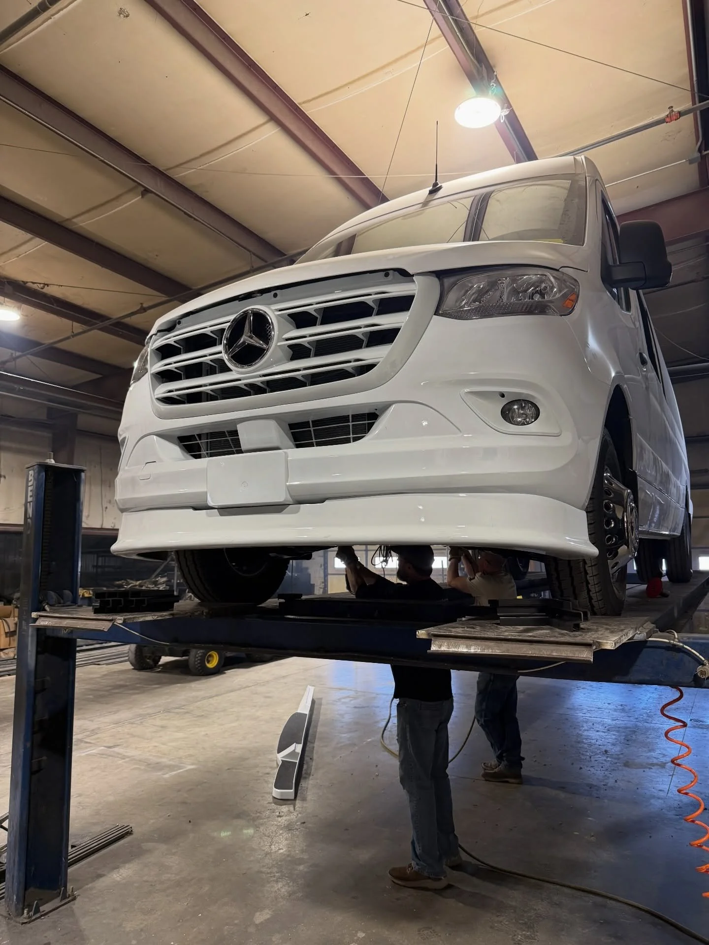 Stop buying stock. Start building smart.

White custom Mercedes Sprinter getting its final touches underneath &mdash; molded running boards installed and dialed in. The details you don&rsquo;t see are what separate a real build from a quick upfit.

I