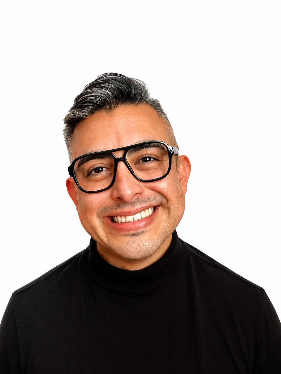 Close-up of a smiling man with glasses, short welted hair, wearing a black turtleneck, against a plain white background.