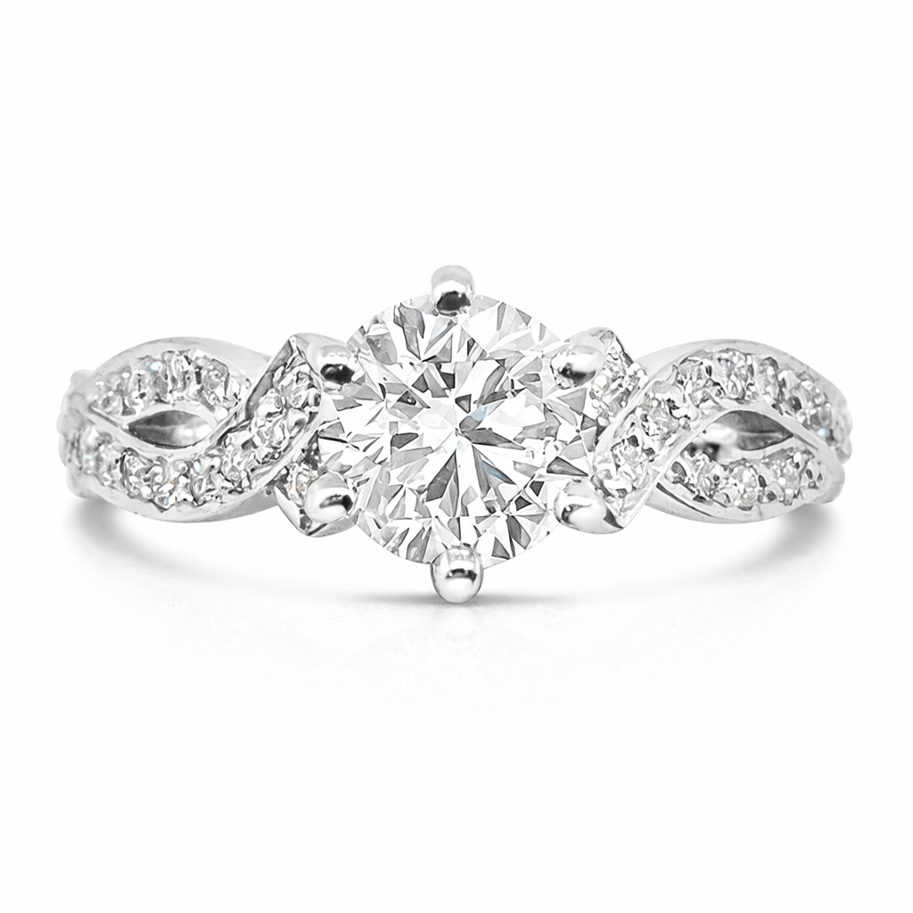 White gold solitaire ring set with a round brilliant cut diamond.