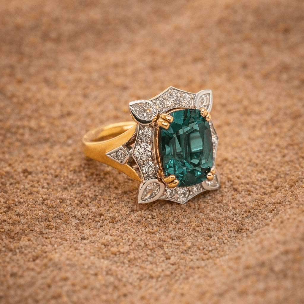 Green tourmaline dress ring set with brilliant cut diamonds in yellow and white gold.
