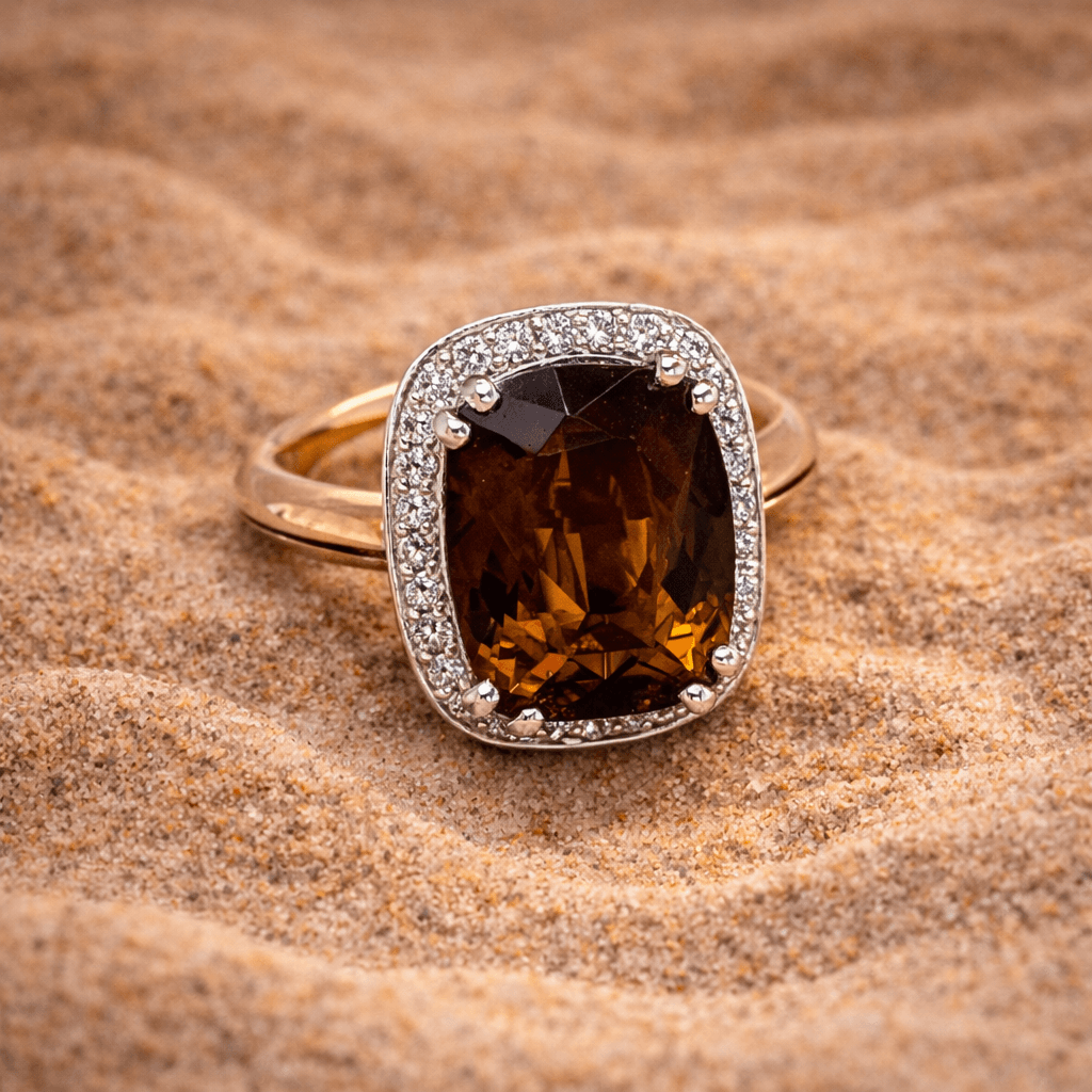 Smoky tourmaline dress ring set with brilliant cut diamonds in white and yellow gold.