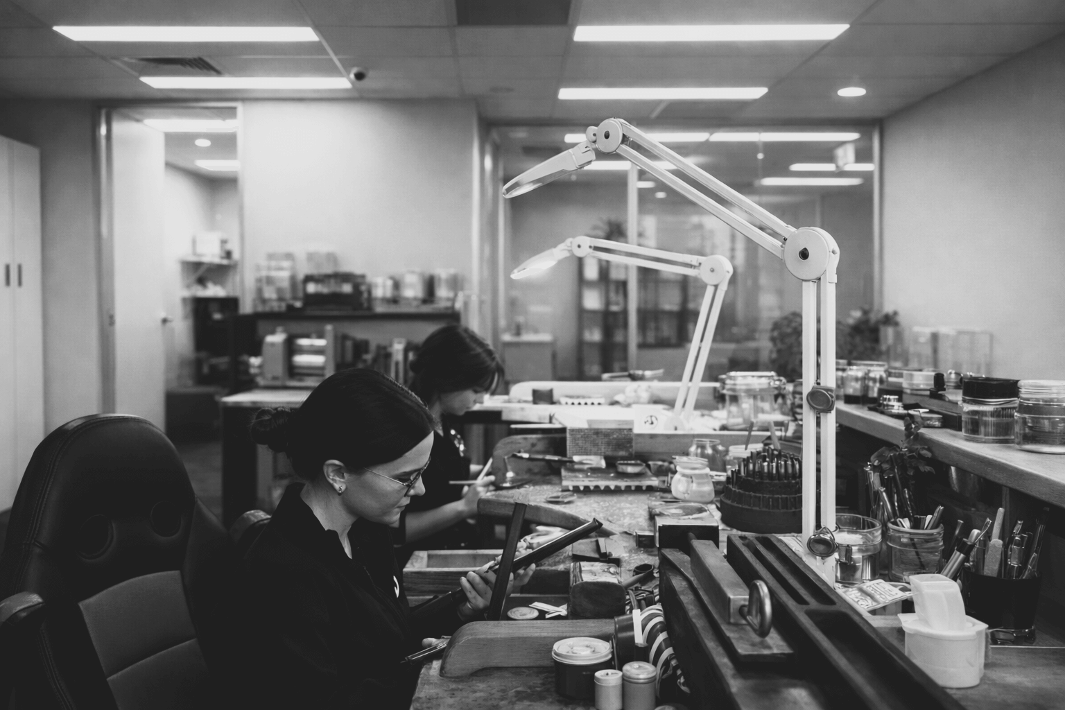 A team of jewellers working in the workshop.