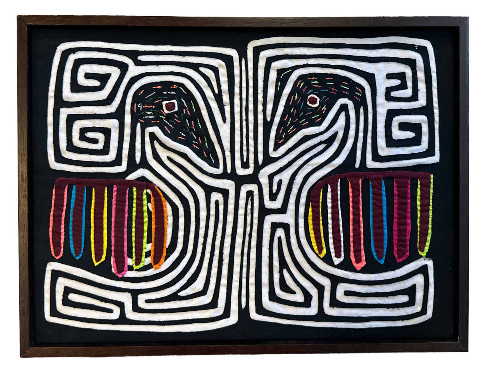 fabric art in a wood frame.