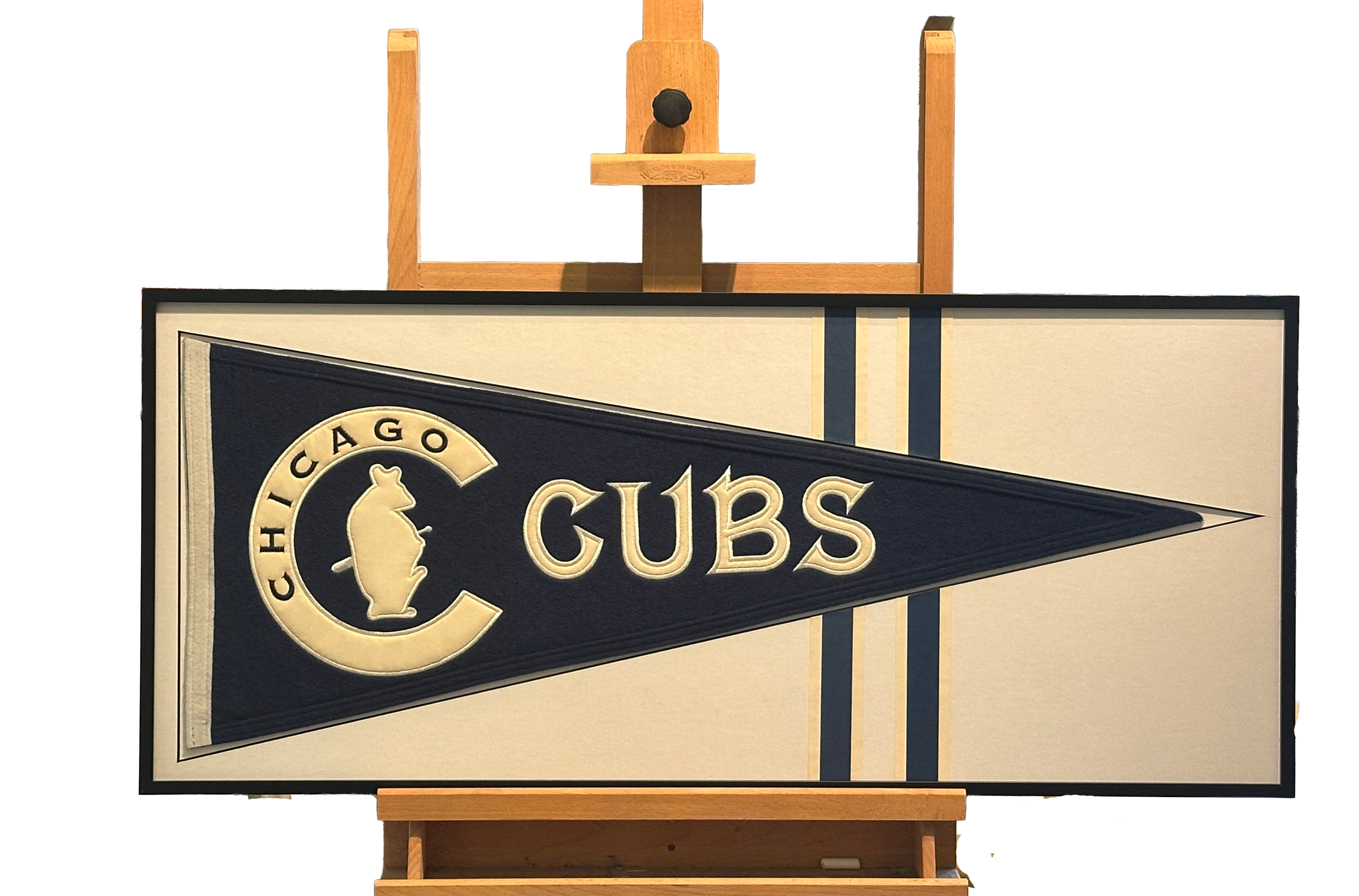 vintage cubs pennant with stripe accents in a metal frame.