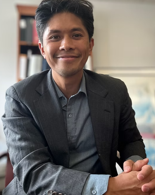 Headshot of Seattle attorney Mark Perez smiling at camera.
