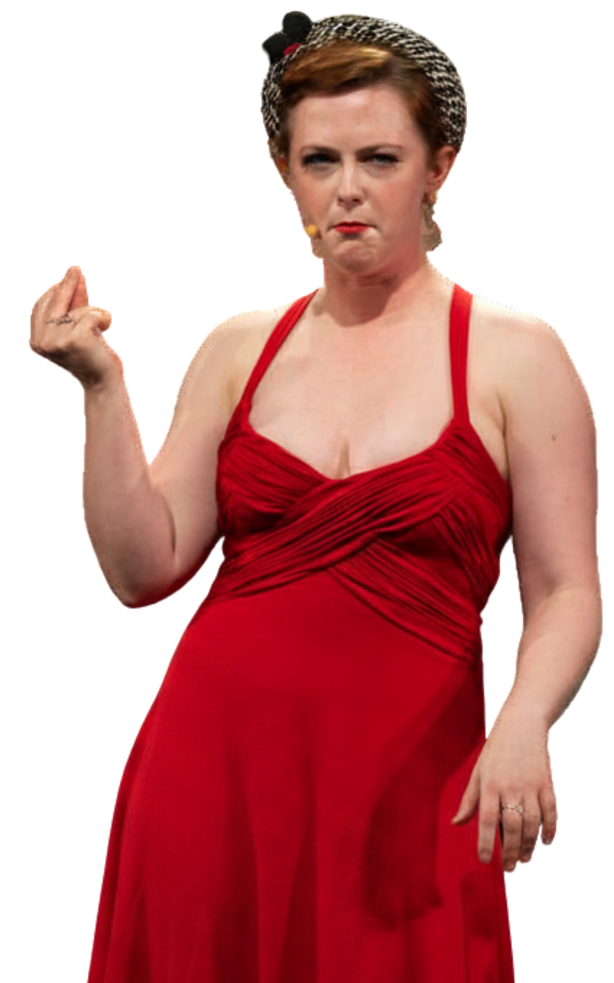 A woman wearing a red dress with the top gathered and pleated, holding her right arm up with her elbow bent and her thumb pointing to her temple, with a serious or determined facial expression.