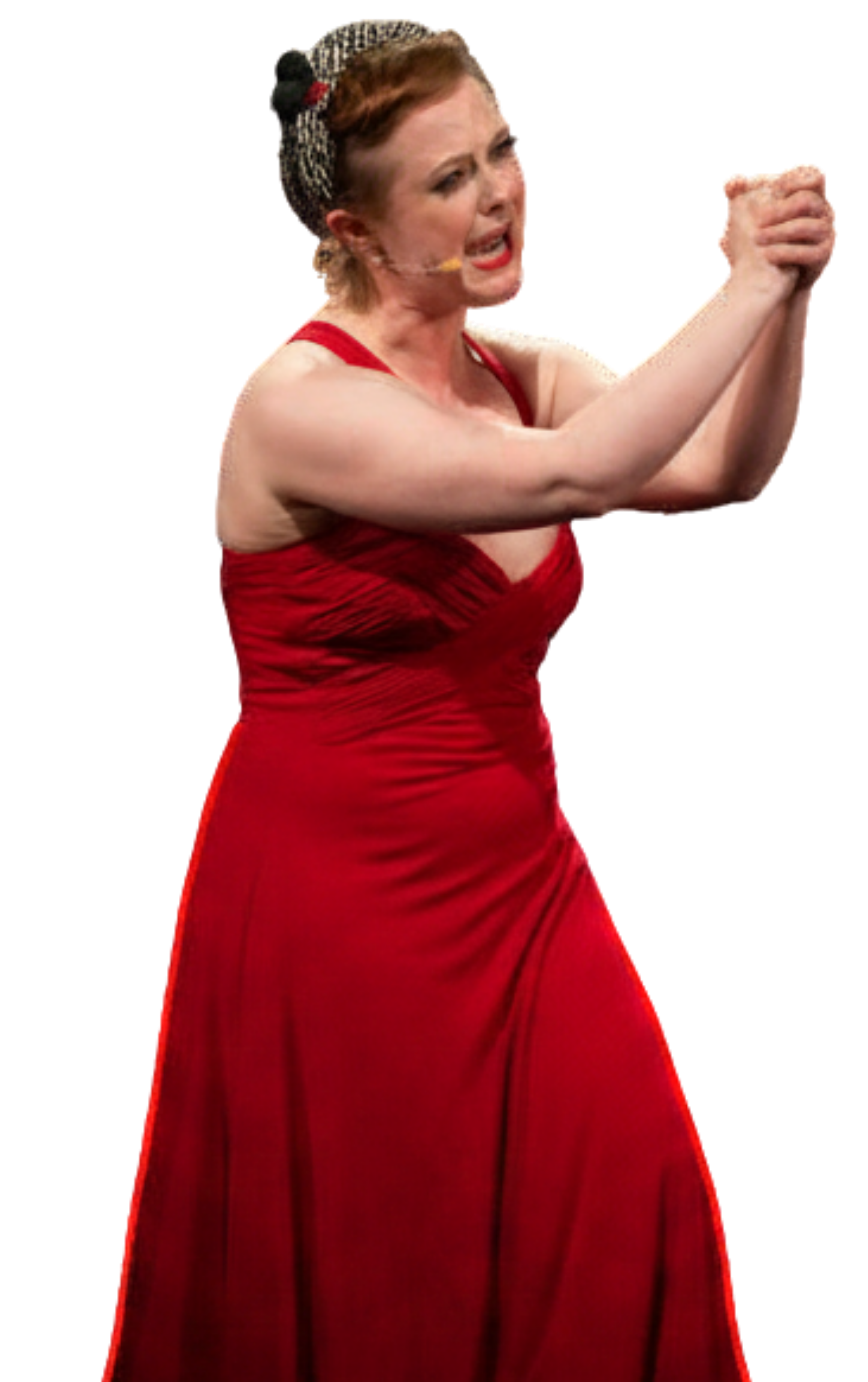 Woman in a red dress with short hair and headband, appearing upset or emotional, clasping hands together.