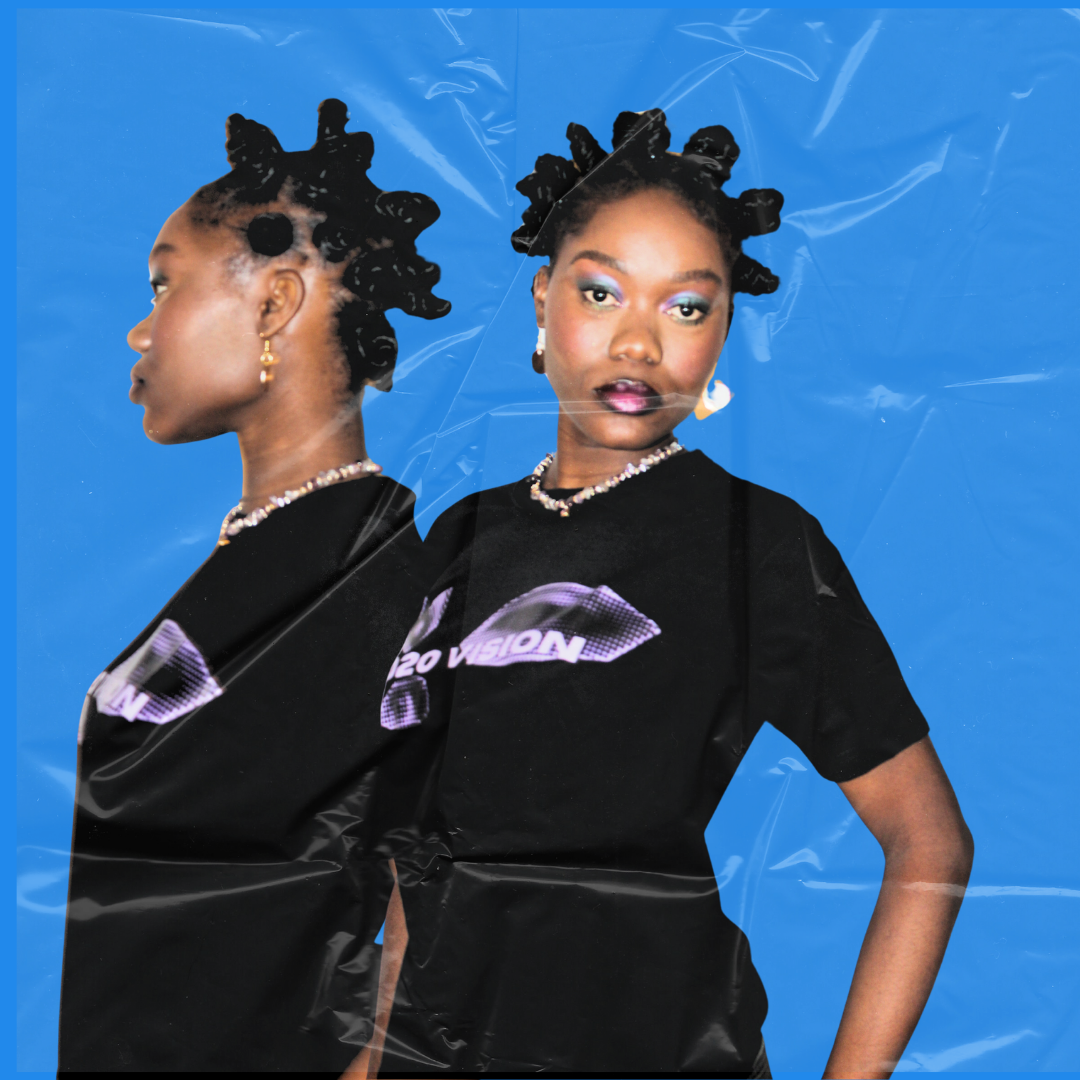 Two women with bantu knots hairstyle standing against a blue background, one facing left and one facing forward, both wearing black shirts with digital graphic designs and jewelry.