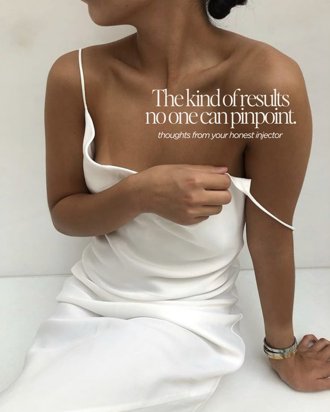 Portrait of a woman in silky white fabric with text overlay about subtle injectable results, created for aesthetics brand content by ARCHV HAUS, a Seattle-based social media management agency.