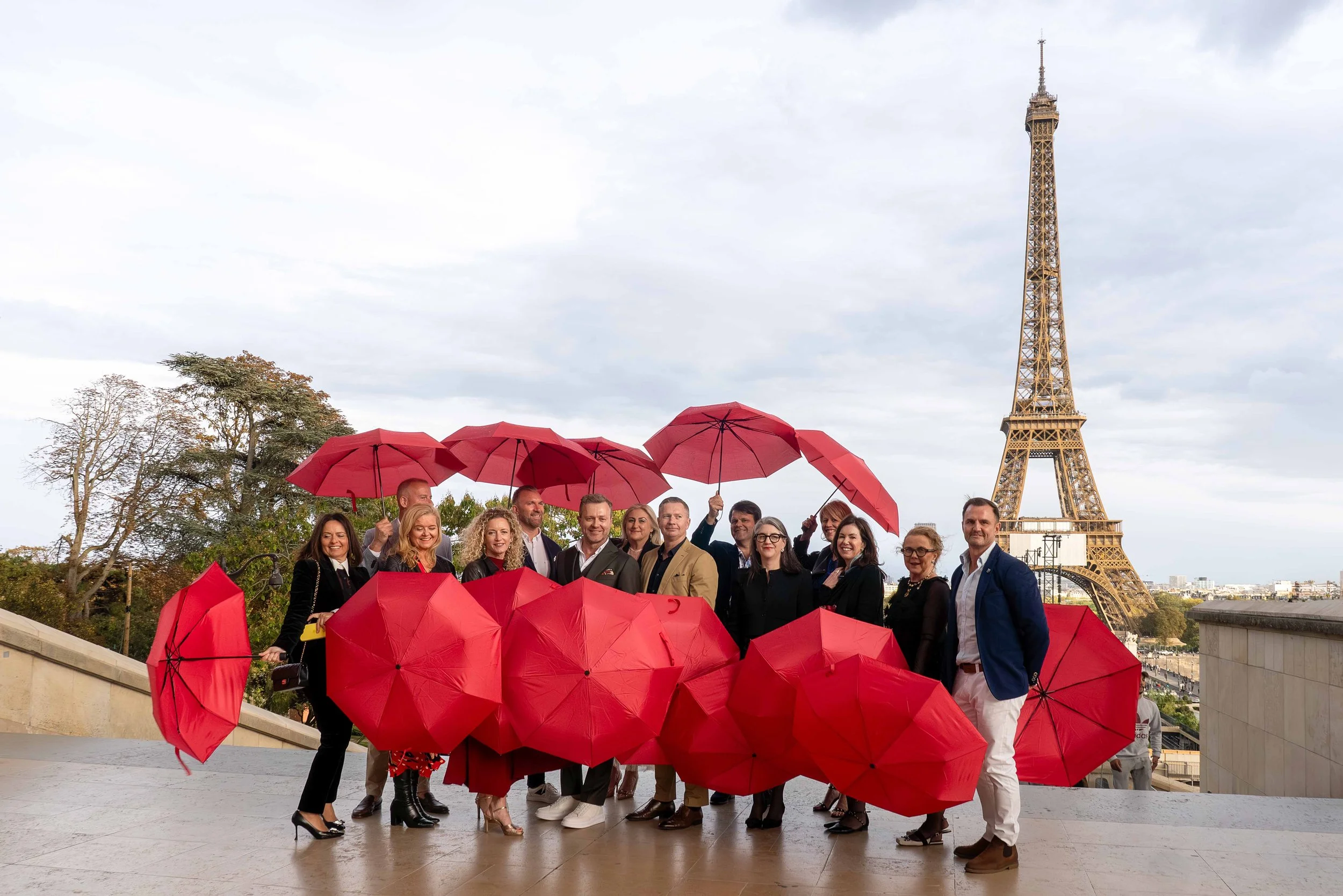 Close-up of sandy beach with shallow, clear water revealing patterns and small stones beneath the surface.
