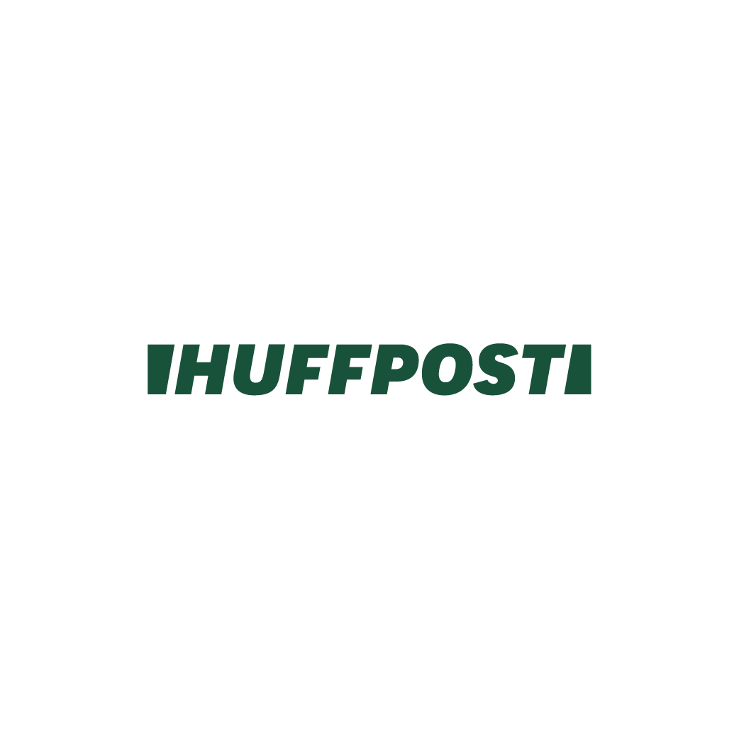 Black silhouette of a person sitting at a desk with a computer, with a second person standing nearby, overall dark background, and text 'IHUffPost' in green across the image.