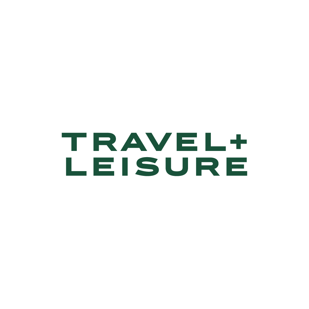 A black background with a green text overlay that says 'TRAVEL + LEISURE'.