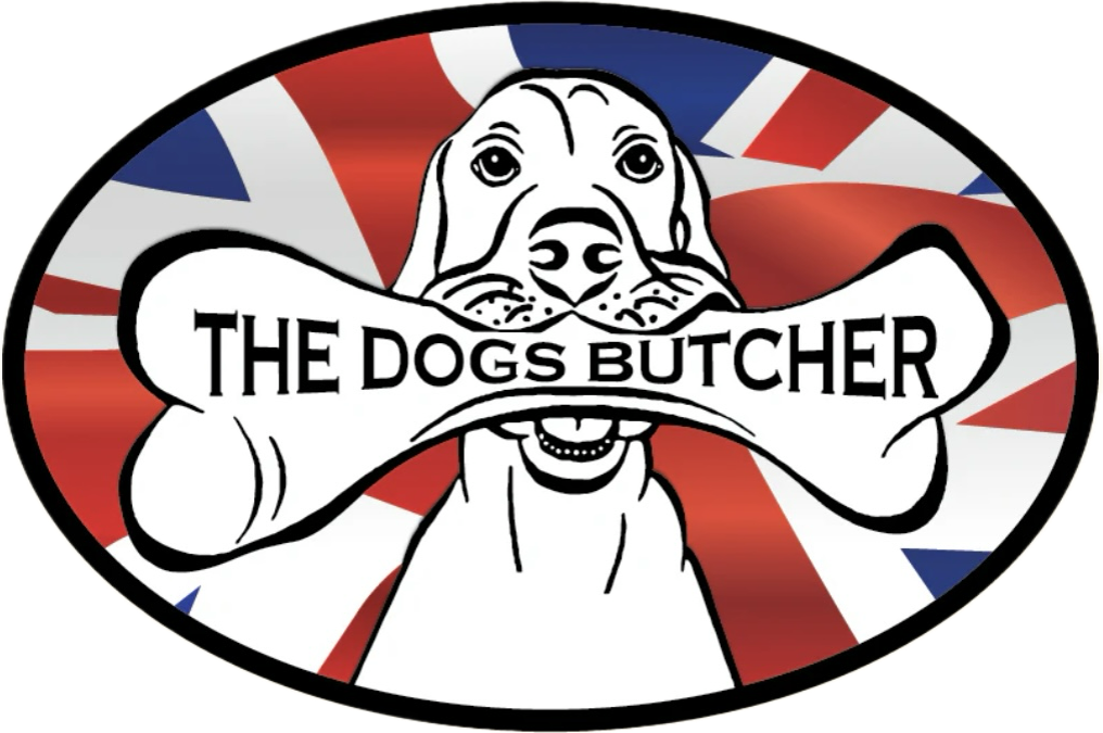 Logo of The Dogs Butcher featuring a cartoon dog holding a bone in its mouth with the business name on the bone, against a background resembling the Union Jack flag.
