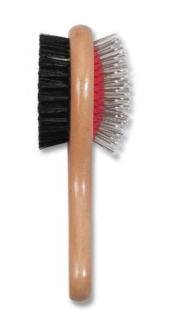 A shoe brush with black bristles on one side and white and red bristles on the other side, a wooden handle in the center.