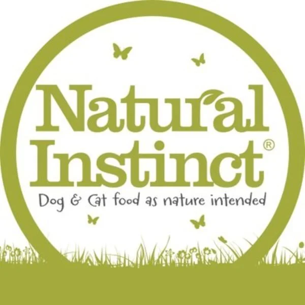Logo for Natural Instinct featuring green text, butterflies, and grass, with the slogan "Dog & cat food as nature intended."