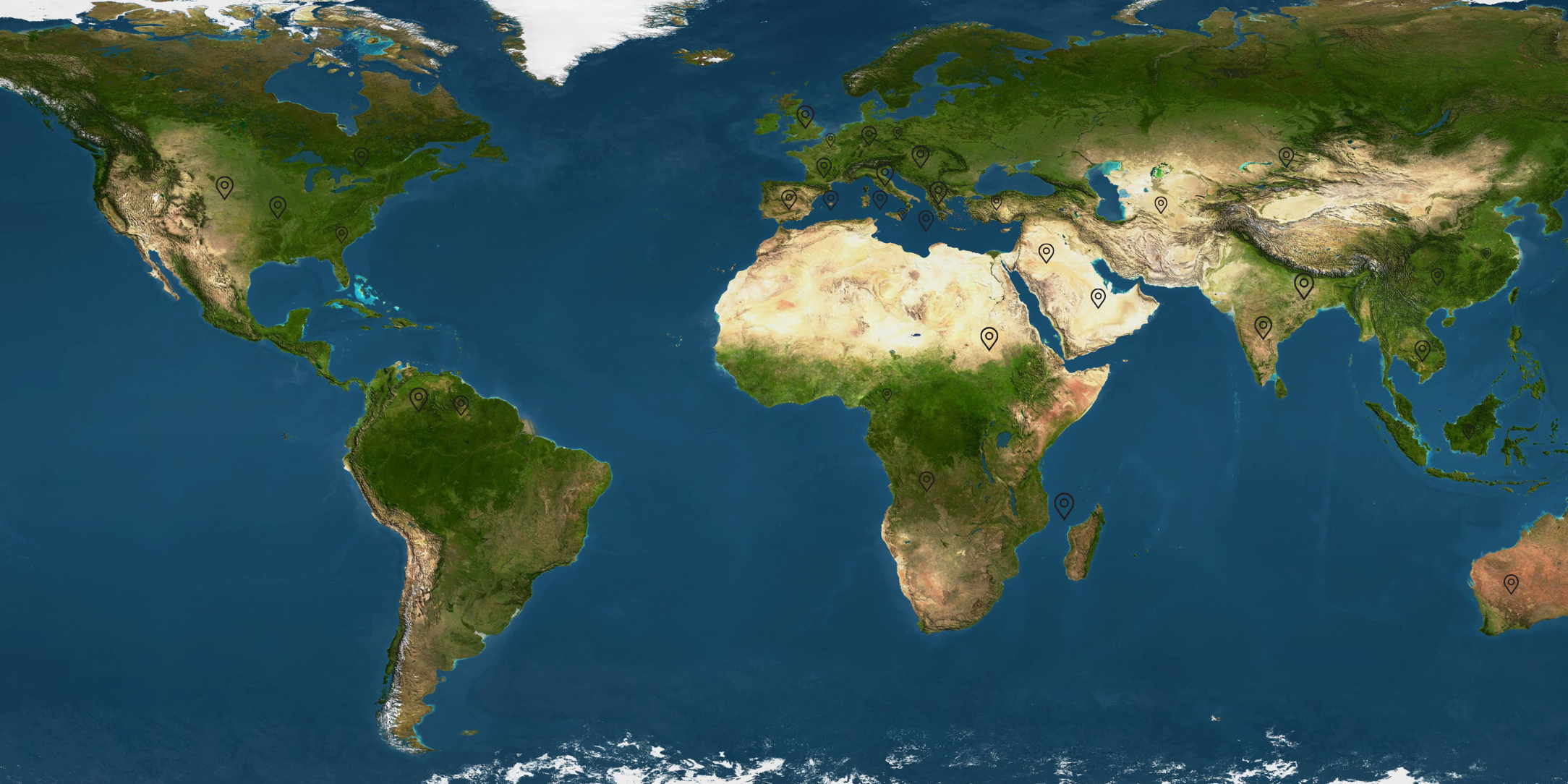 World map showing continents with pins marked in various locations around the globe.