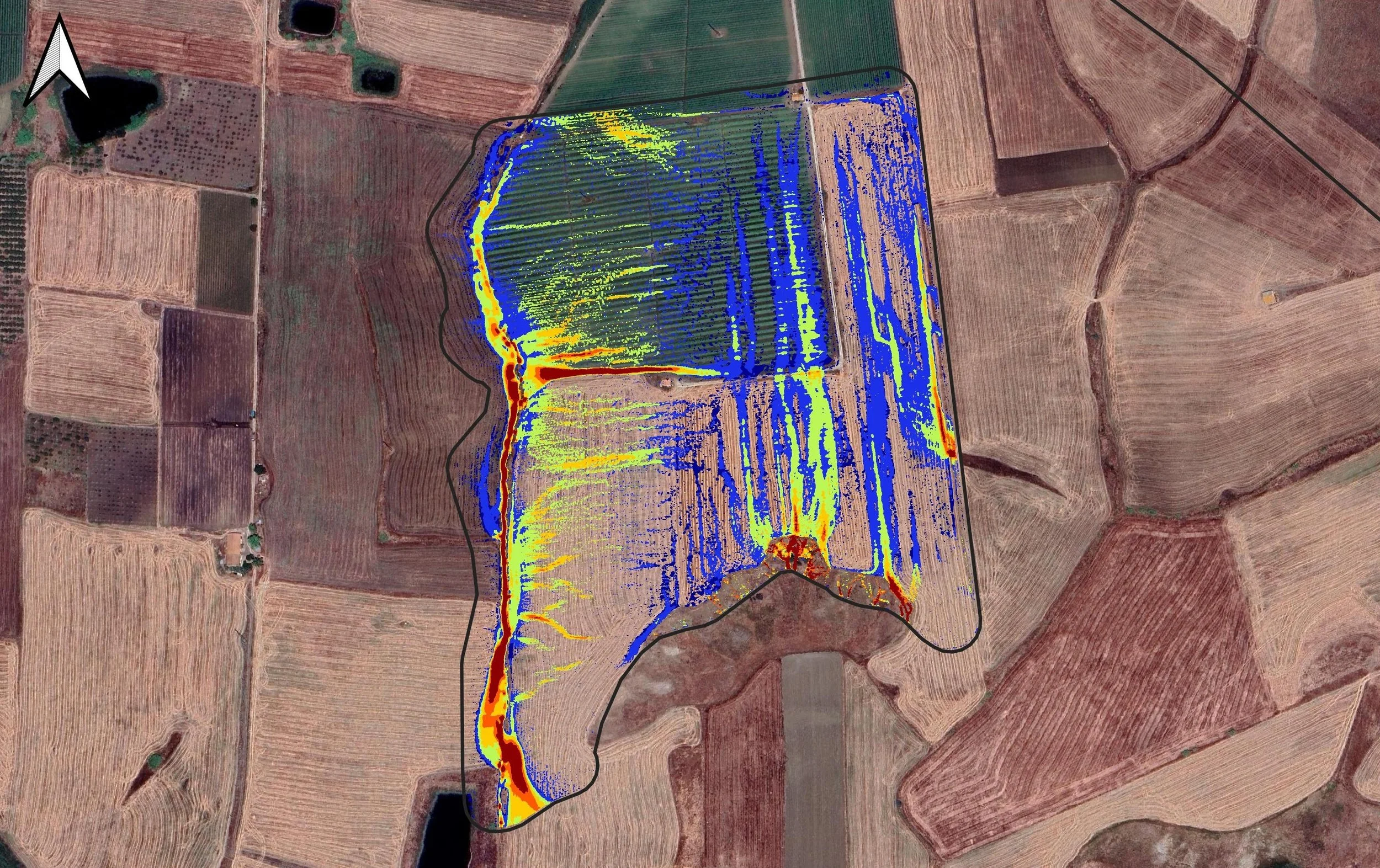 Aerial view of agricultural fields with overlaid color-coded map showing data analysis, outlined with a black border, on a rural landscape with different crop plots and a nearby pond.