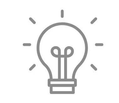 Outline of a light bulb with rays indicating illumination.